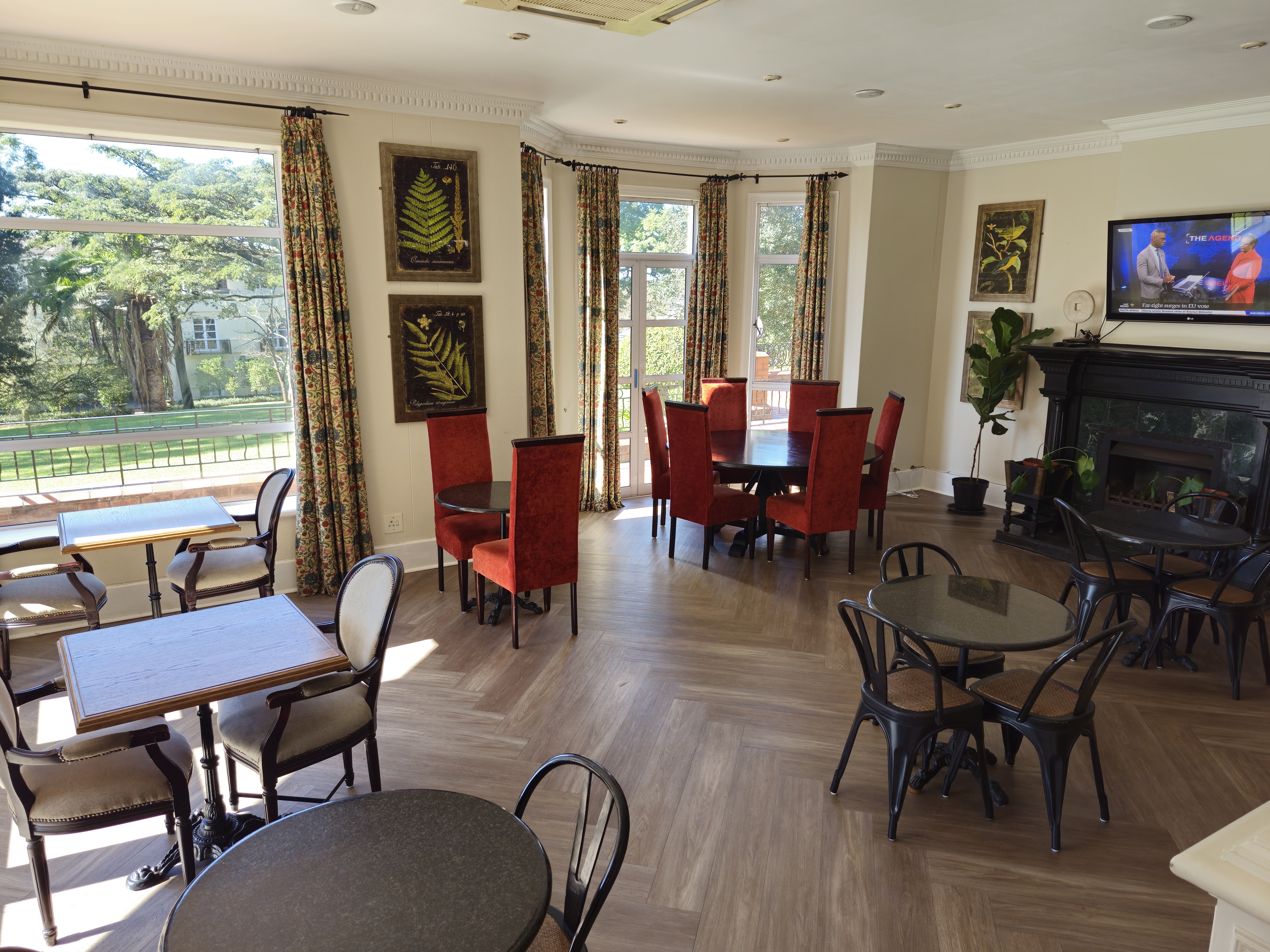 Interior of Redlands Restaurant with elegantly set tables and natural lighting