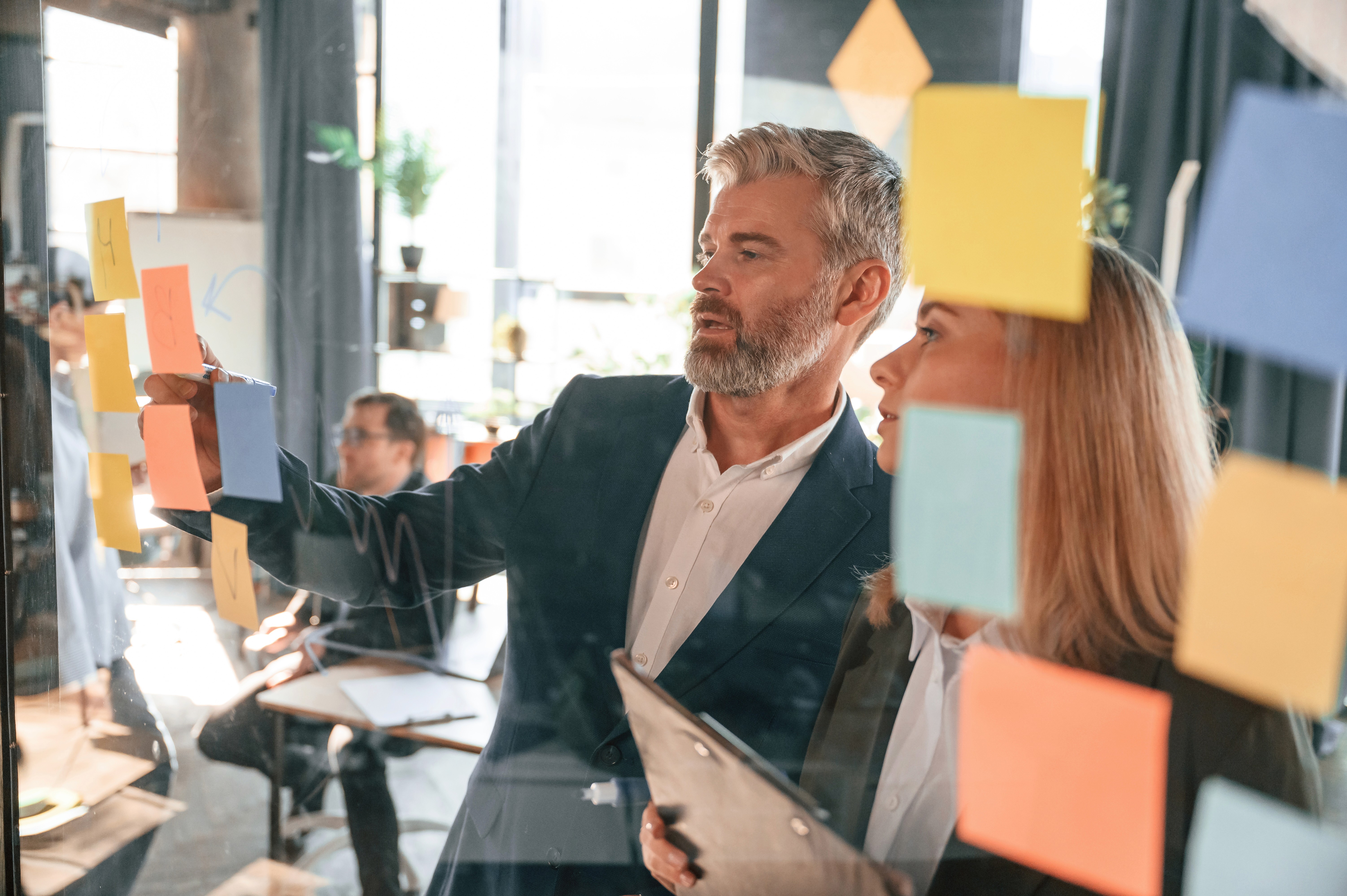 Close-up of a sleek black and silver tech device with a glossy metallic frame and a gradient blue display panel.