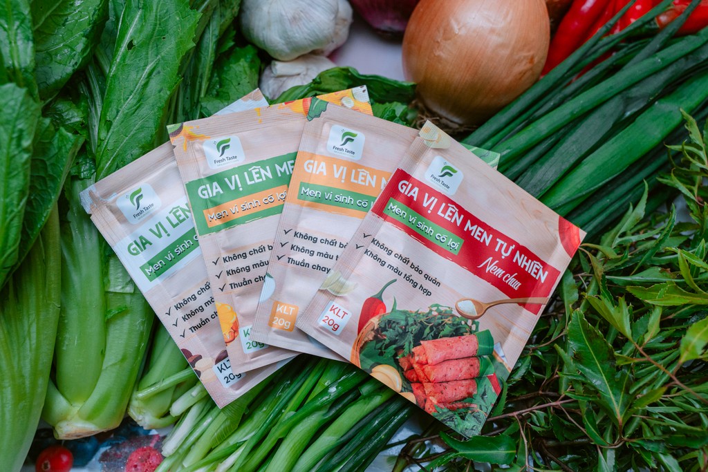 train on bridge surrounded with trees at daytime