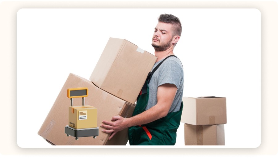 Man struggling to carry boxes