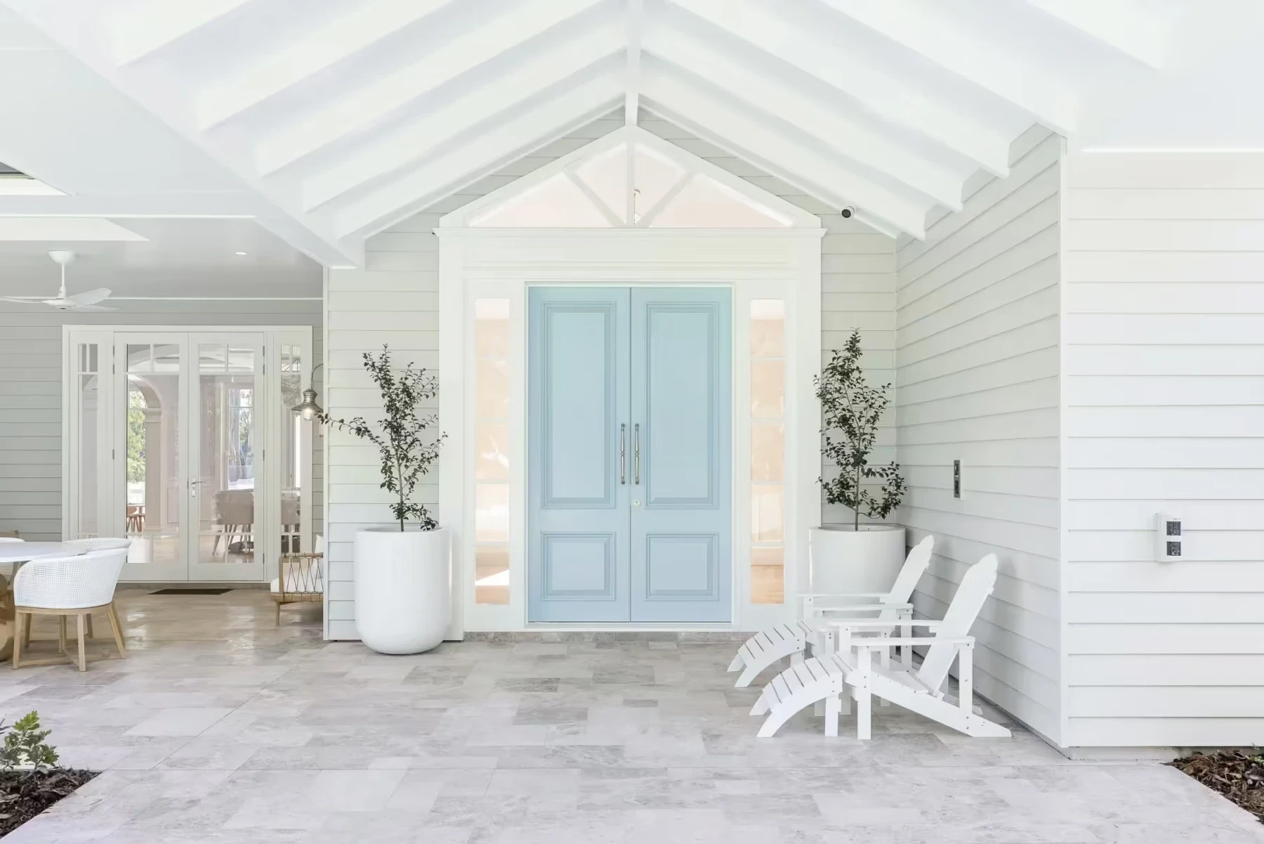 Front door design with integrated materials and soft lighting