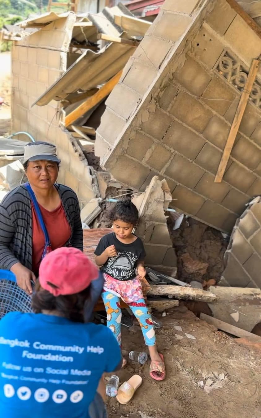 group of children wearing medal standing near wall