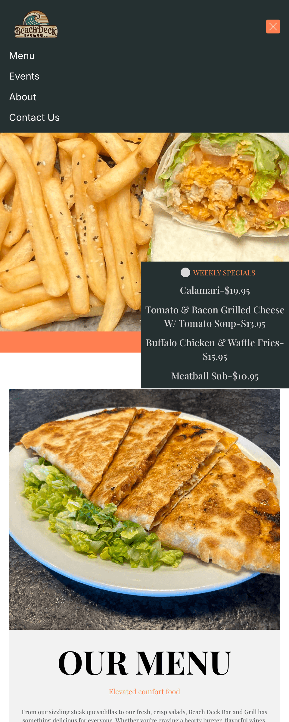 An elephant with large tusks in a lush green landscape.