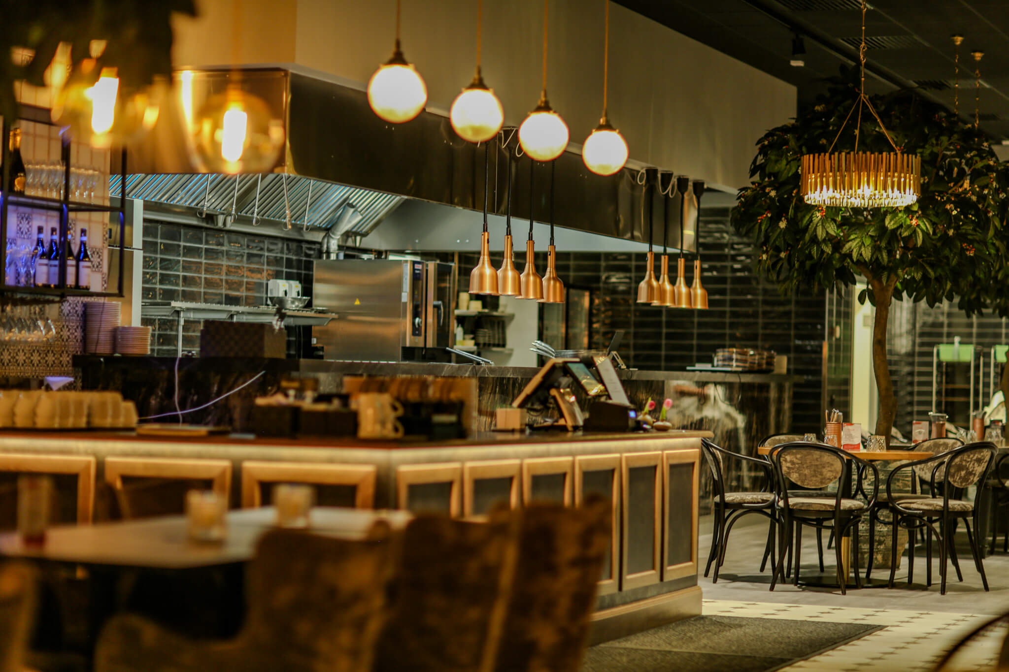 boutique Italian restaurant with a green theme, showcasing a pasta dish, soft and cozy