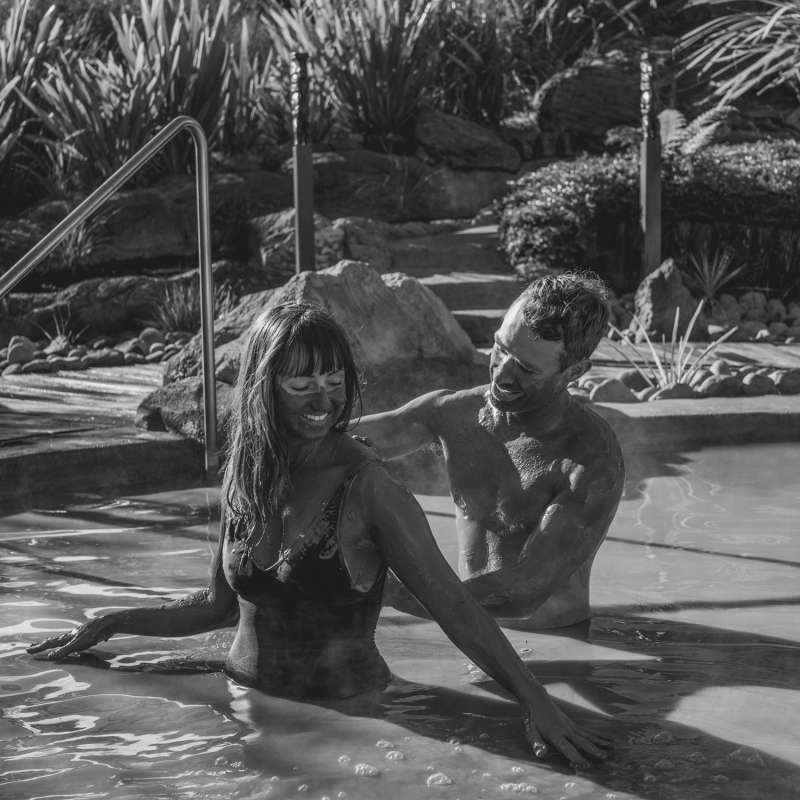 A couple enjoying a mud bath at Hell's Gate, Rotorua