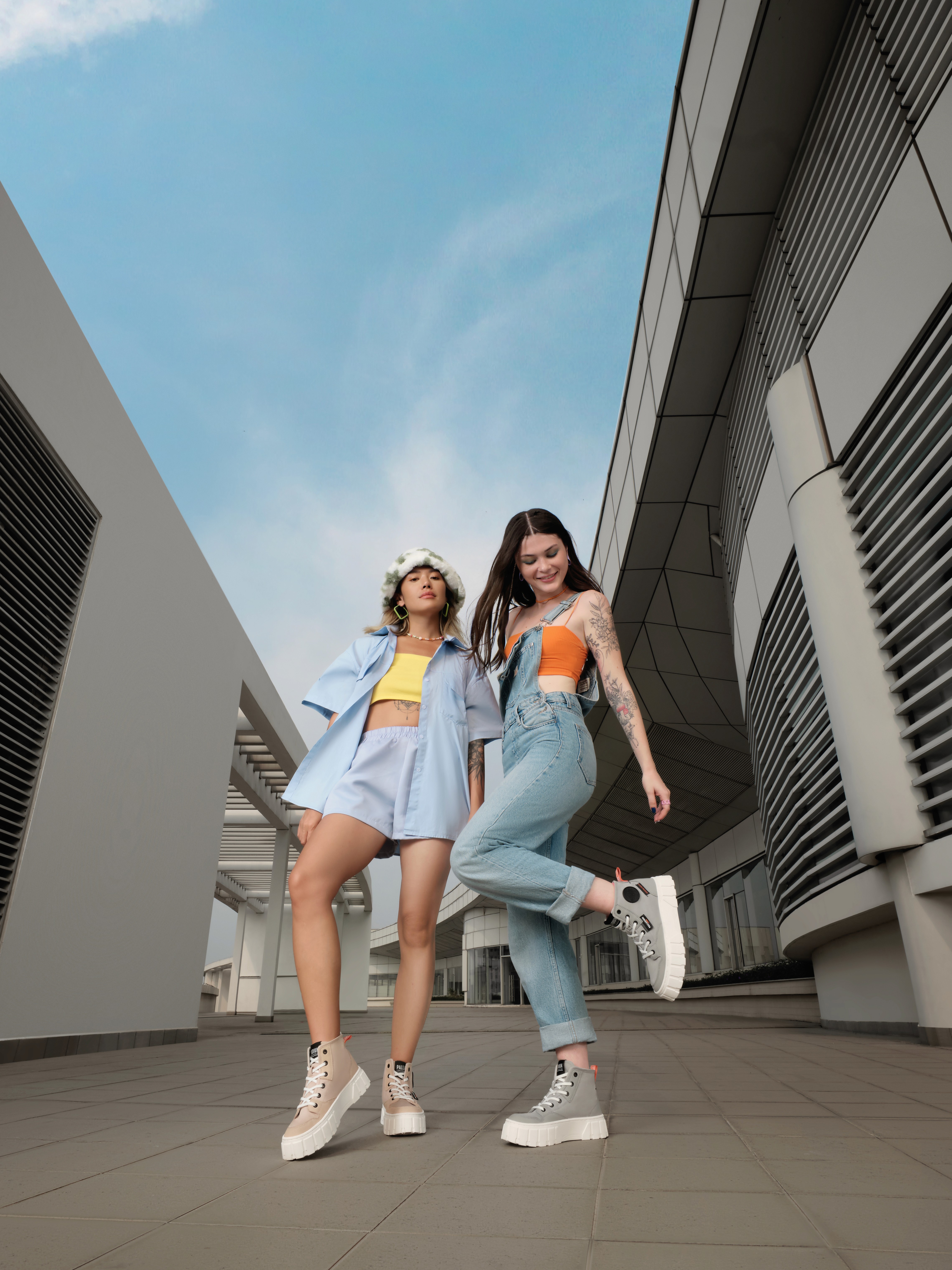 Streetside billboard with flyposters of the Batch.Works brand and illustrations