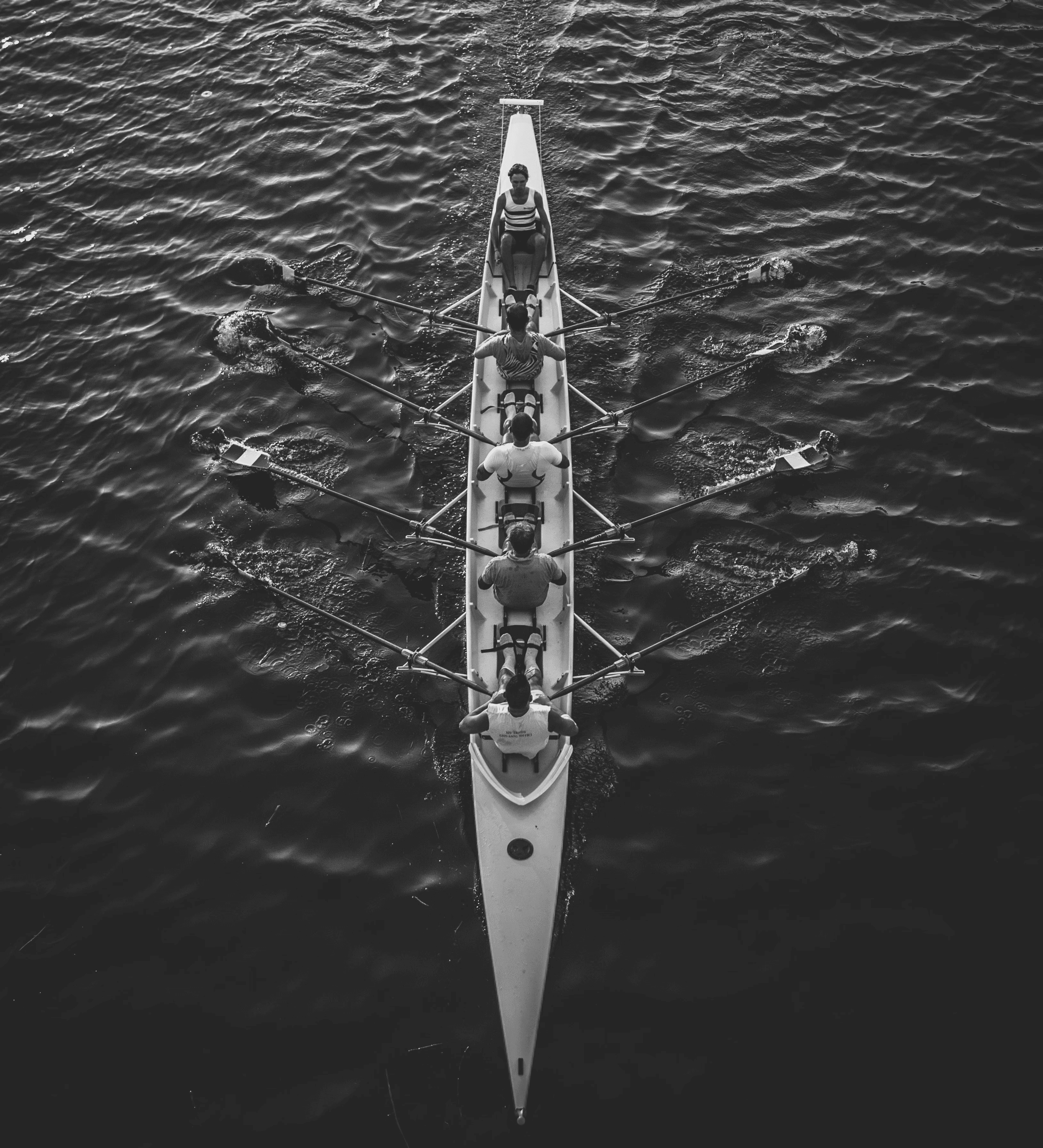 three men sitting on chair beside tables