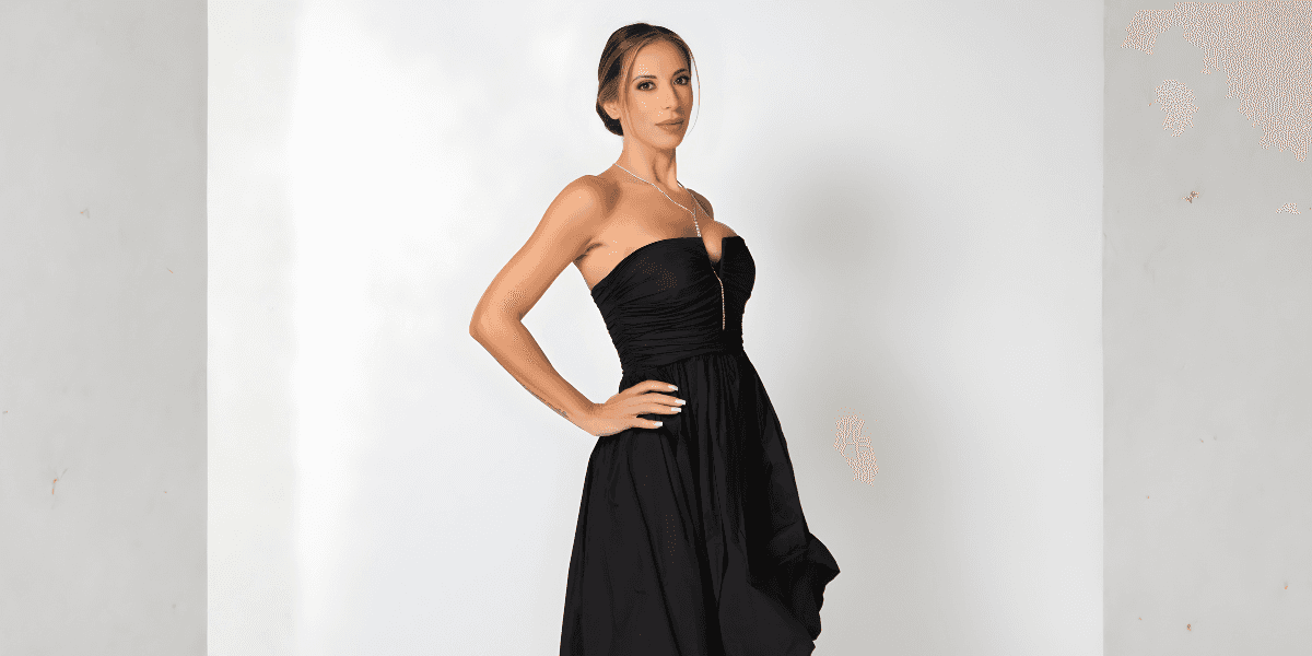 The image appears to showcase Valeria Petza in a black dress, exuding elegance and confidence, fitting her luxury real estate leadership.