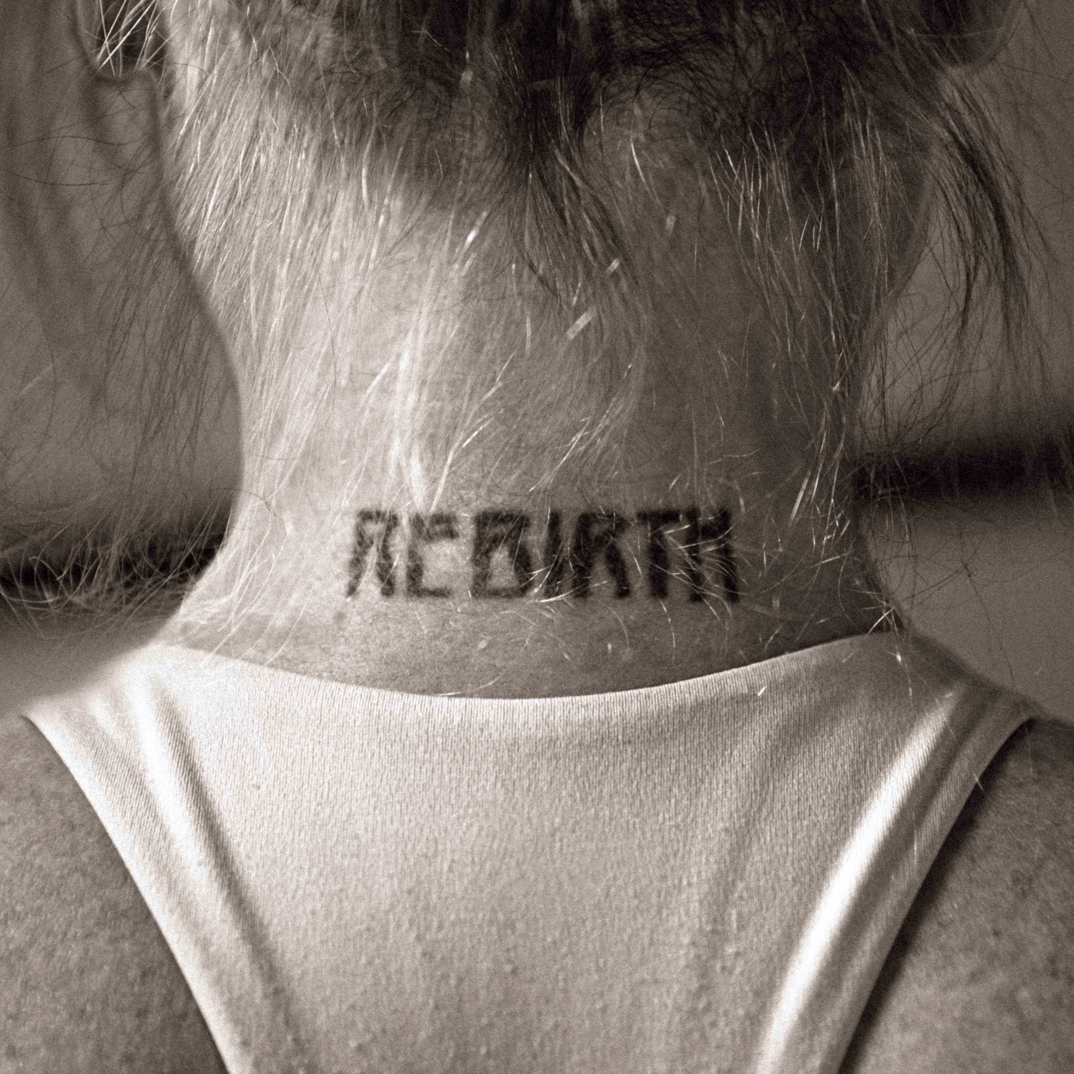 A woman lying down on a soft surface with her eyes closed, bathed in warm sunlight filtering through leaves. Her face has a natural glow, reflecting relaxation and tranquility in a serene spa-like setting.