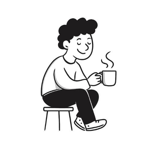 clear drinking glass with coffee on top of white table