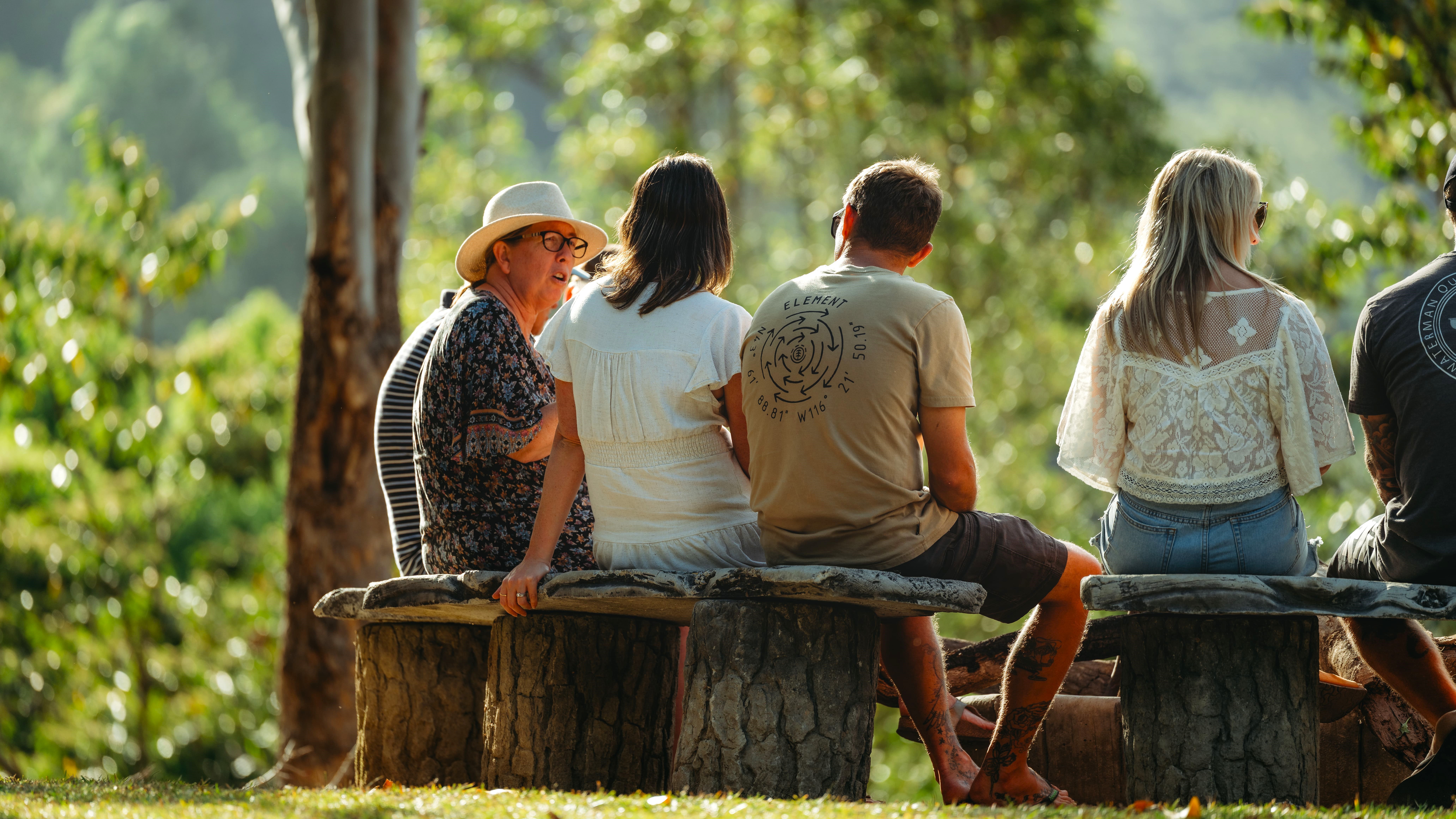A man stading with Surfboard