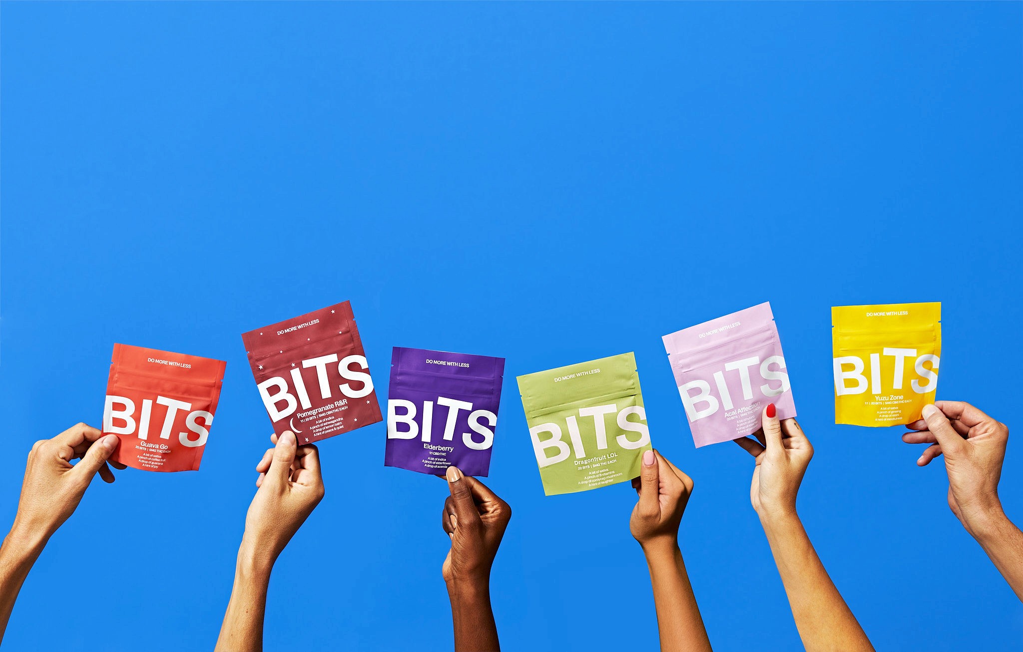 Young woman with dark hair and bangs, wearing red.