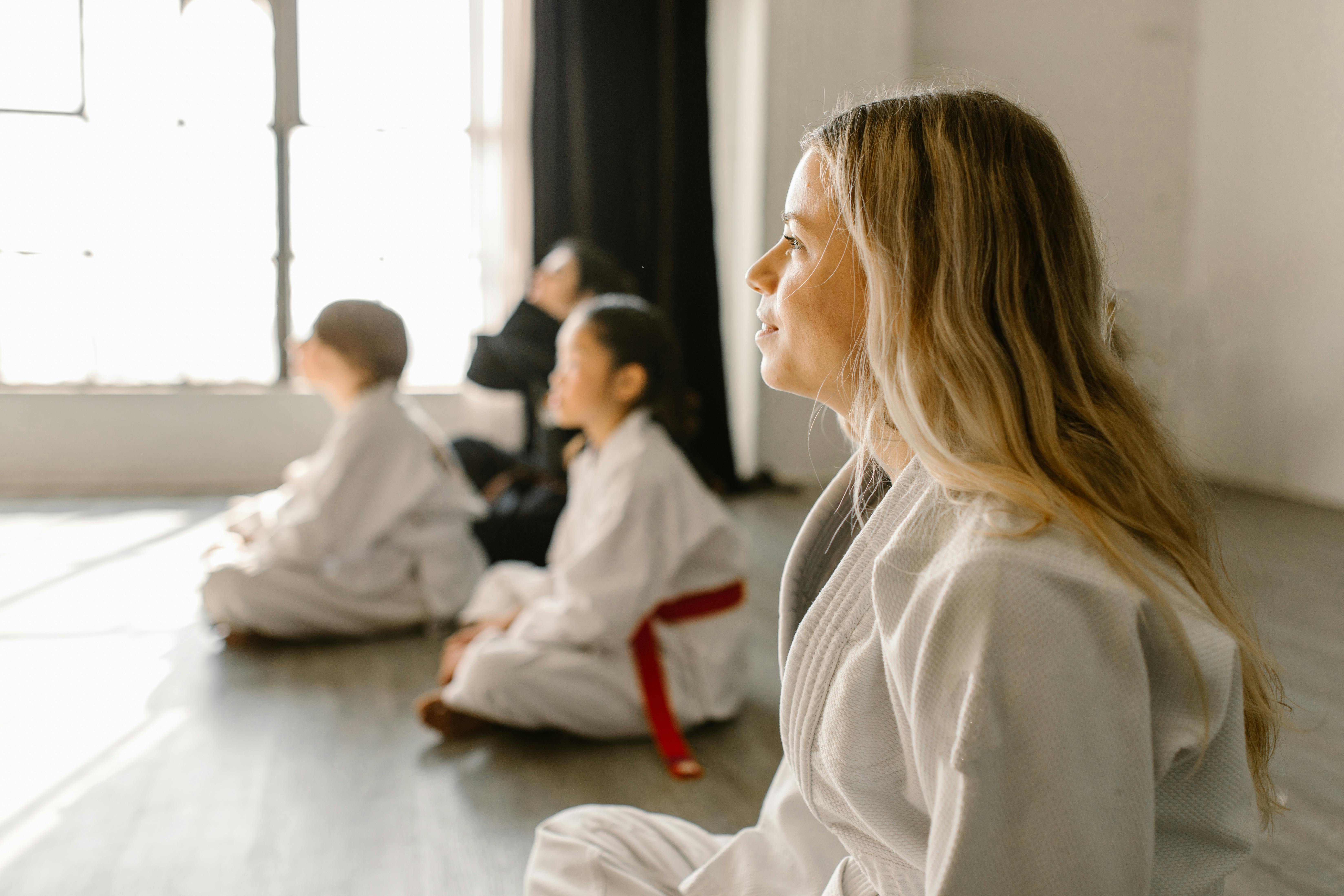 children-and-adults-attentively-listening-in-a-taekwondo-class-session-indoors. - rdne-stock-project (pexels)