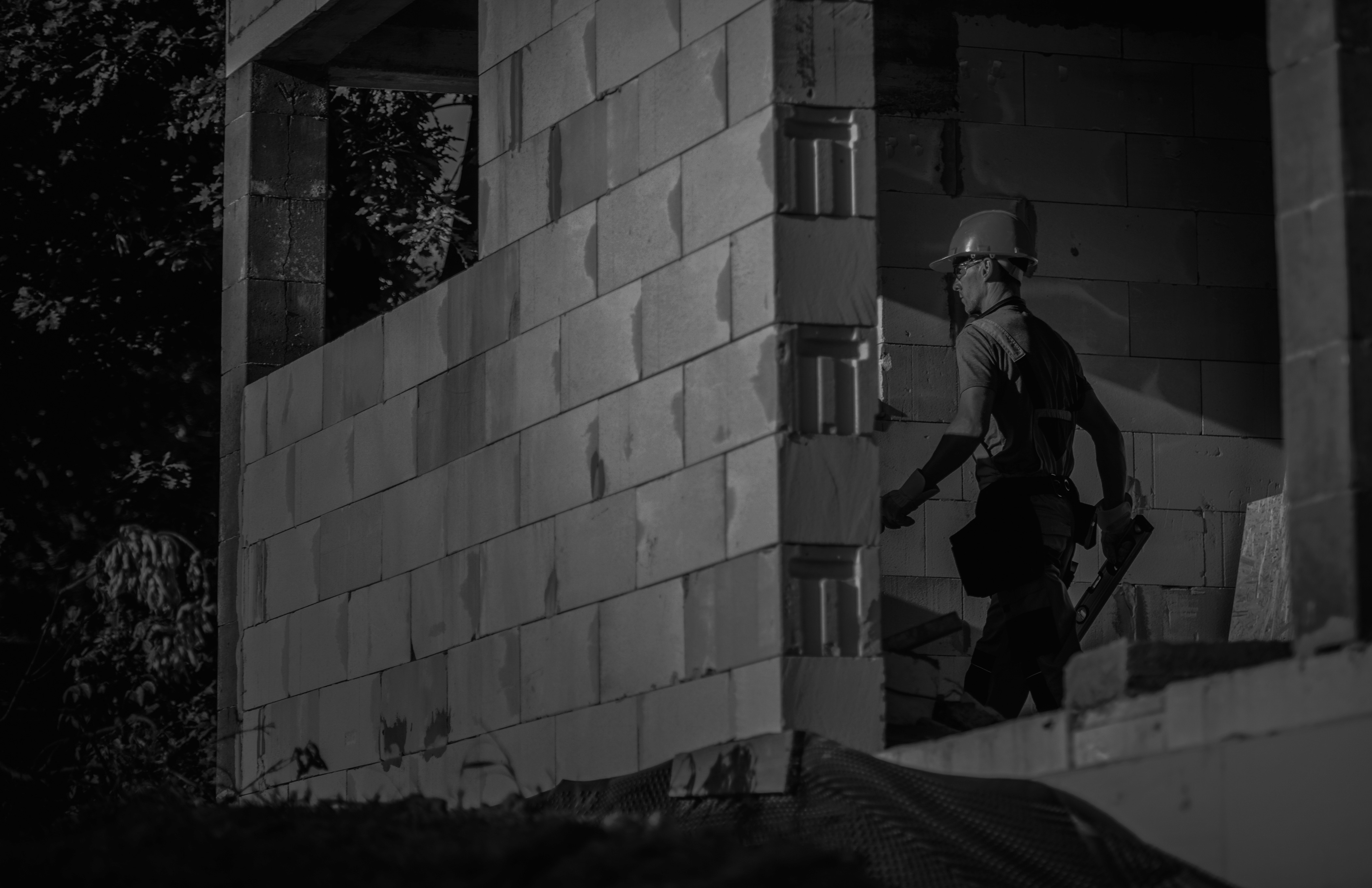 Construction worker building house