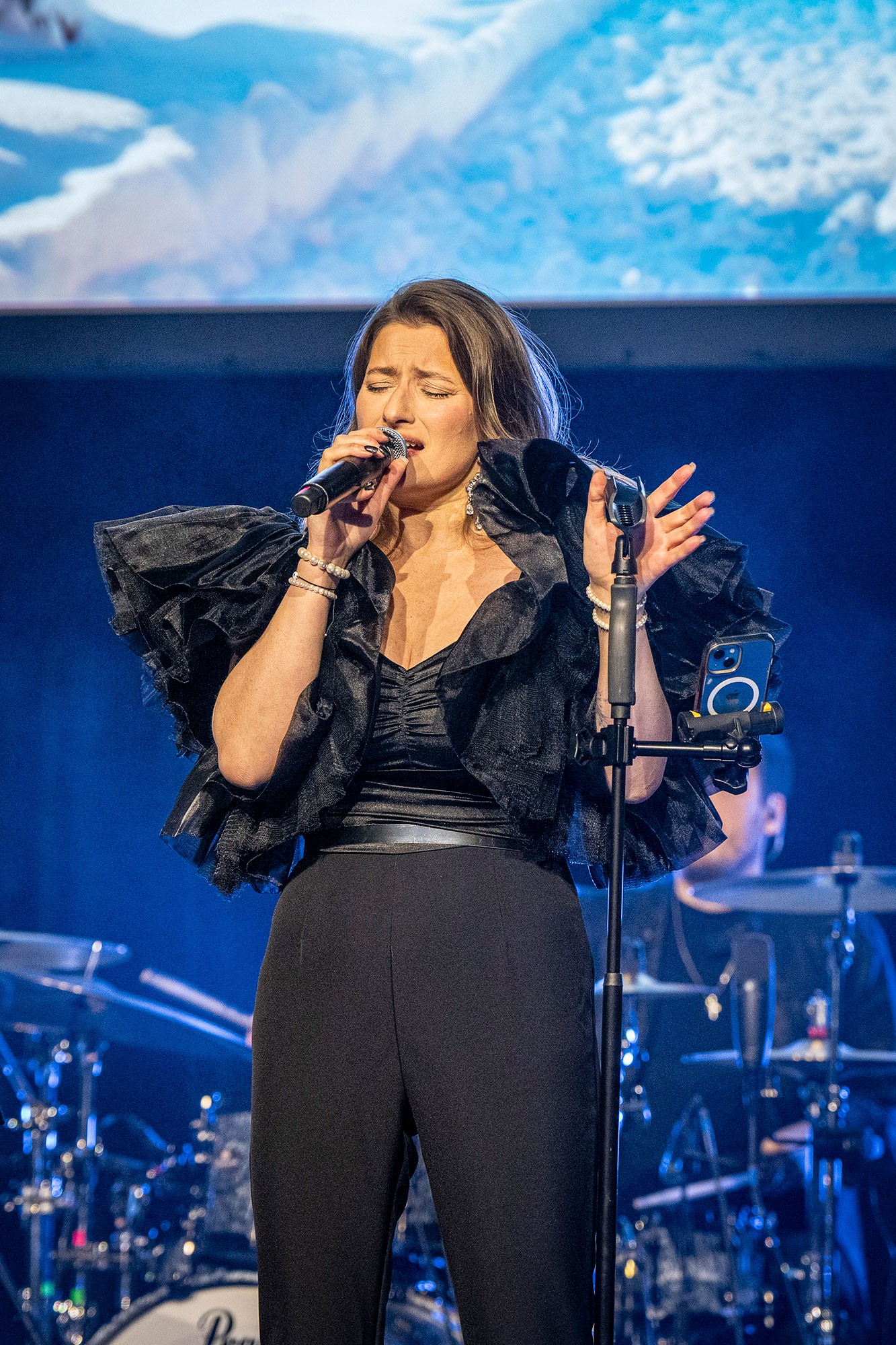 Live music performance during corporate conference evening gala program.