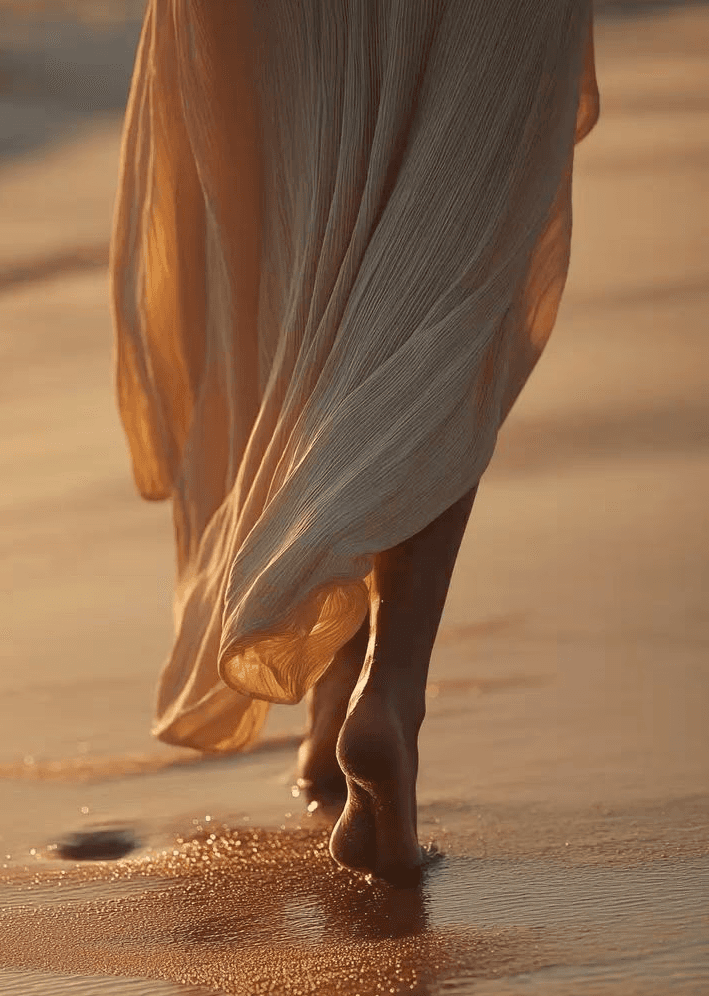 A circle of people sitting cross-legged, meditating with hands in a prayer position. Soft, warm lighting.