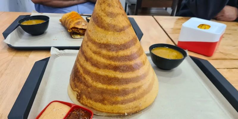 Plain thosai served with a bowl of dhal. 