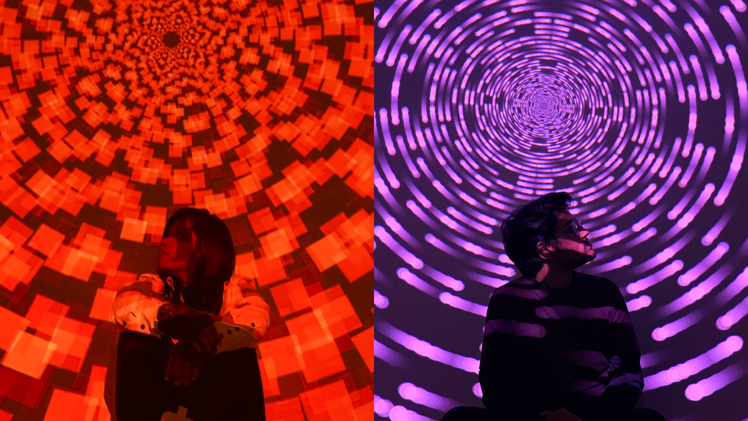 Two people lit by red and purple projected patterns in E-M-O