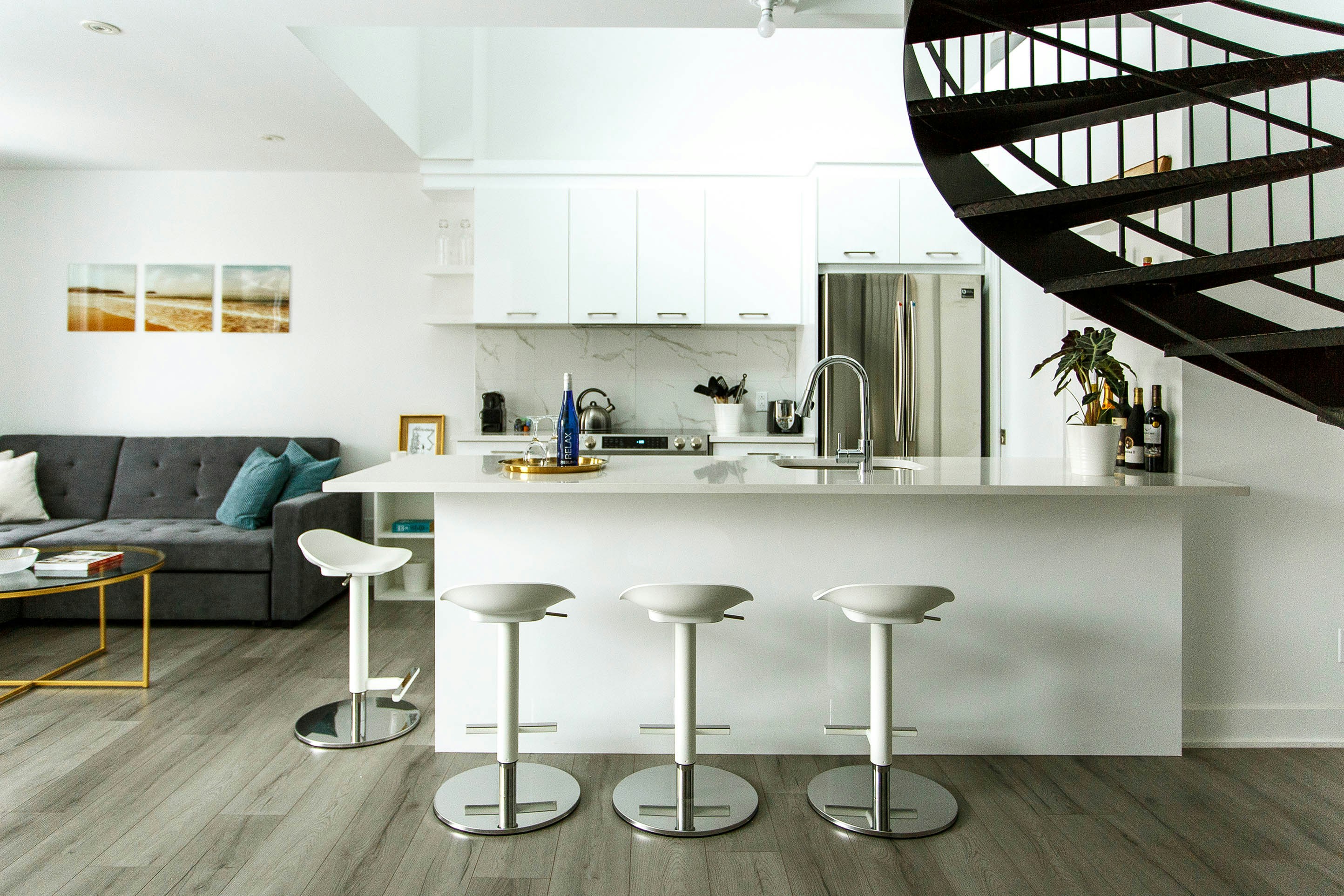 Modern kitchen with a breakfast bar and sleek appliances.