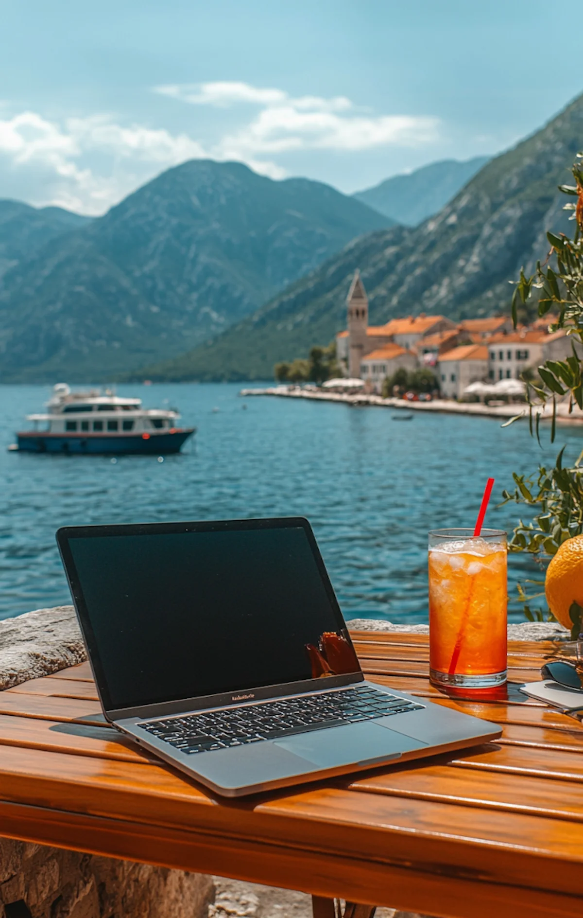 A freelancer laptop on a table in a tropical location