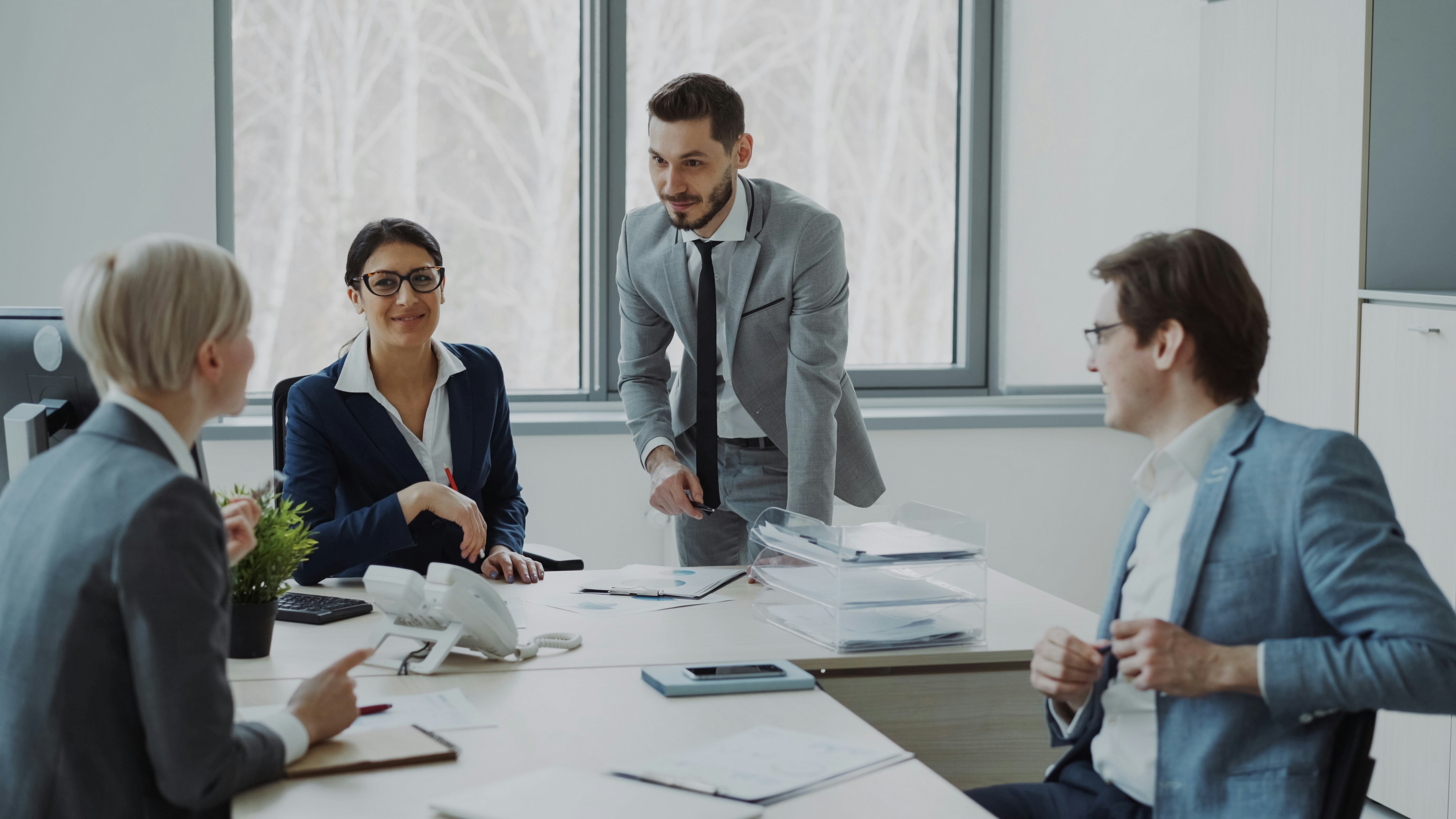 Business professionals collaborating around a conference table.