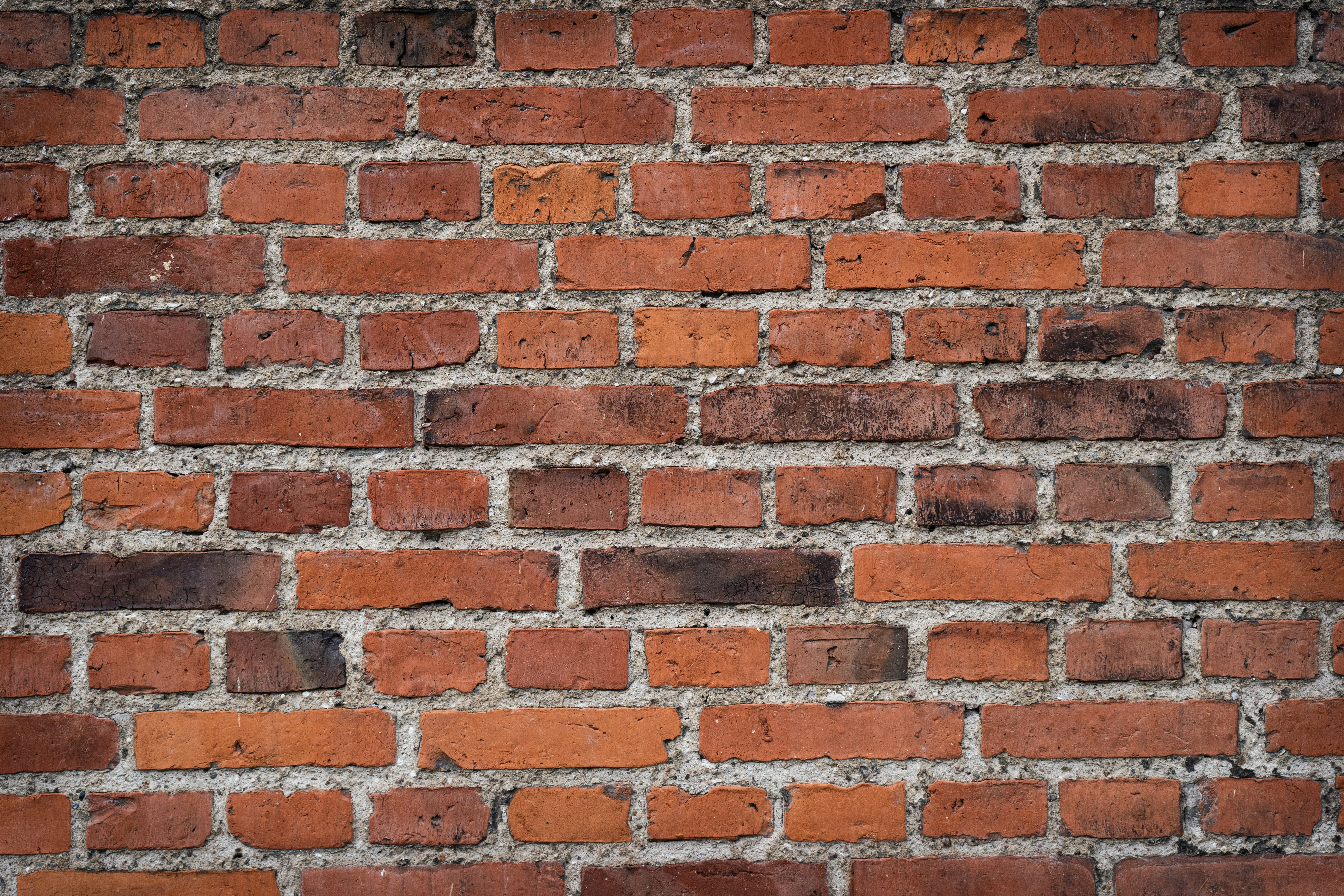 a close up of a red brick wall