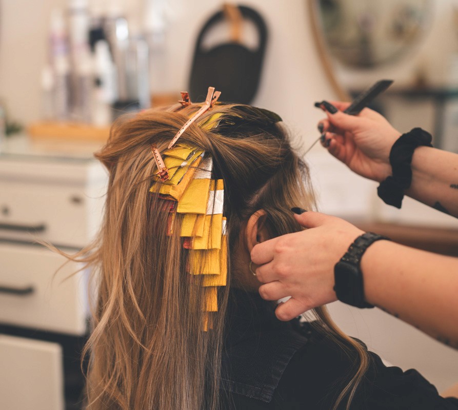 Modern blonding service in progress at Del Sol Hair Studio, Huntington Beach