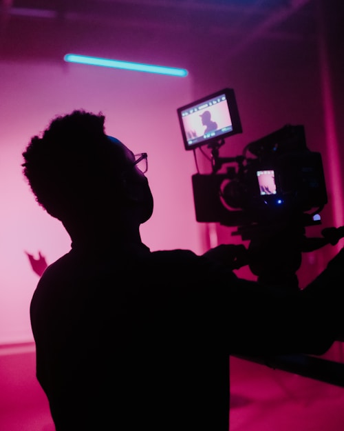 Videographer in dark room