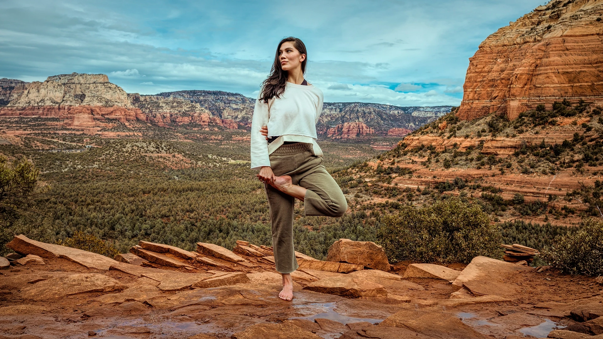Woman doing yoga in the mountains