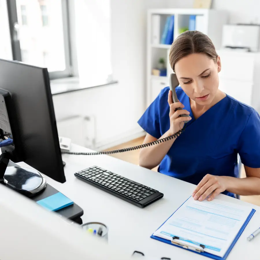 Automating medical note-taking can streamline documentation, as shown by a healthcare professional recording patient information while on a call.