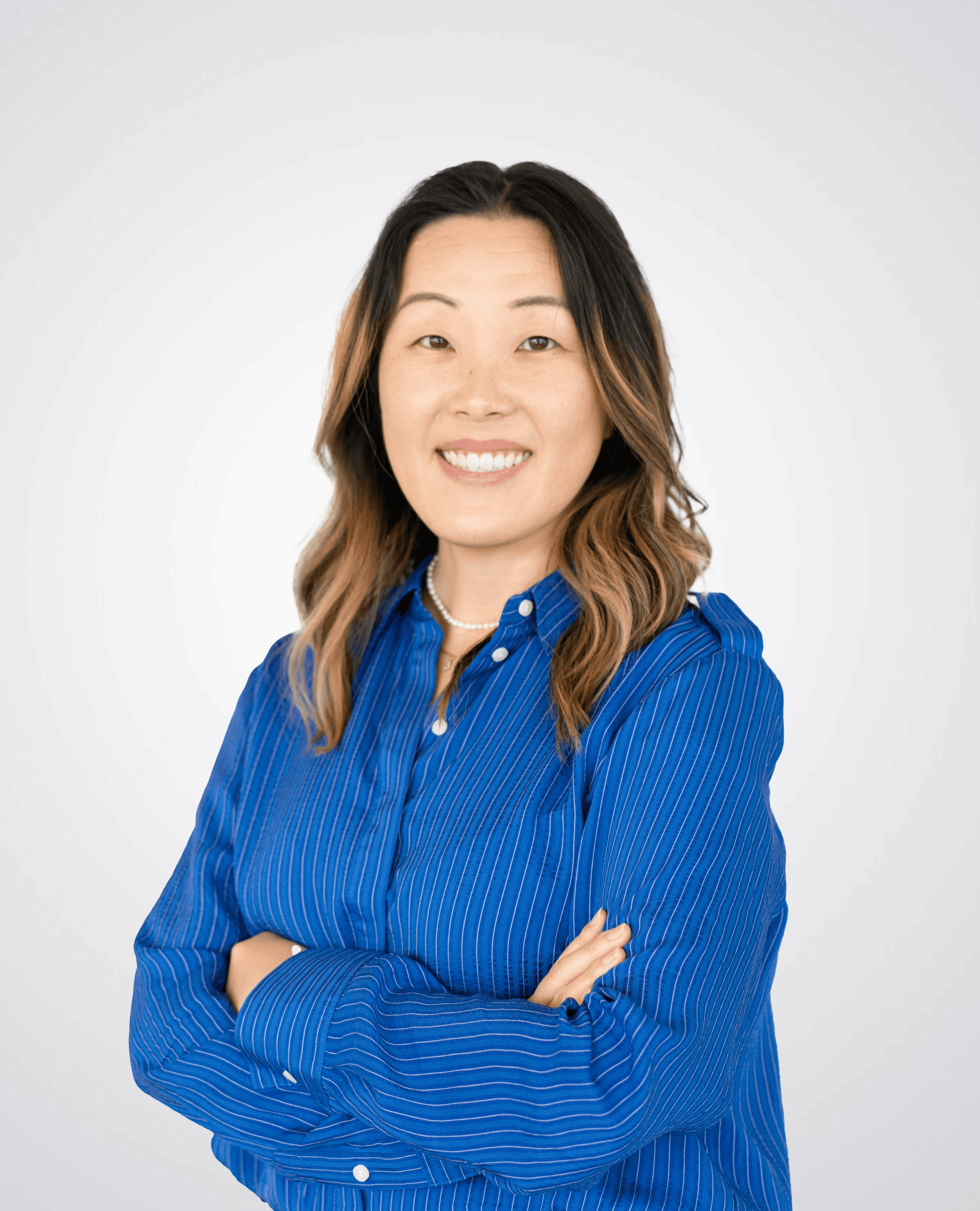 Scientist looking through a microscope in a lab.