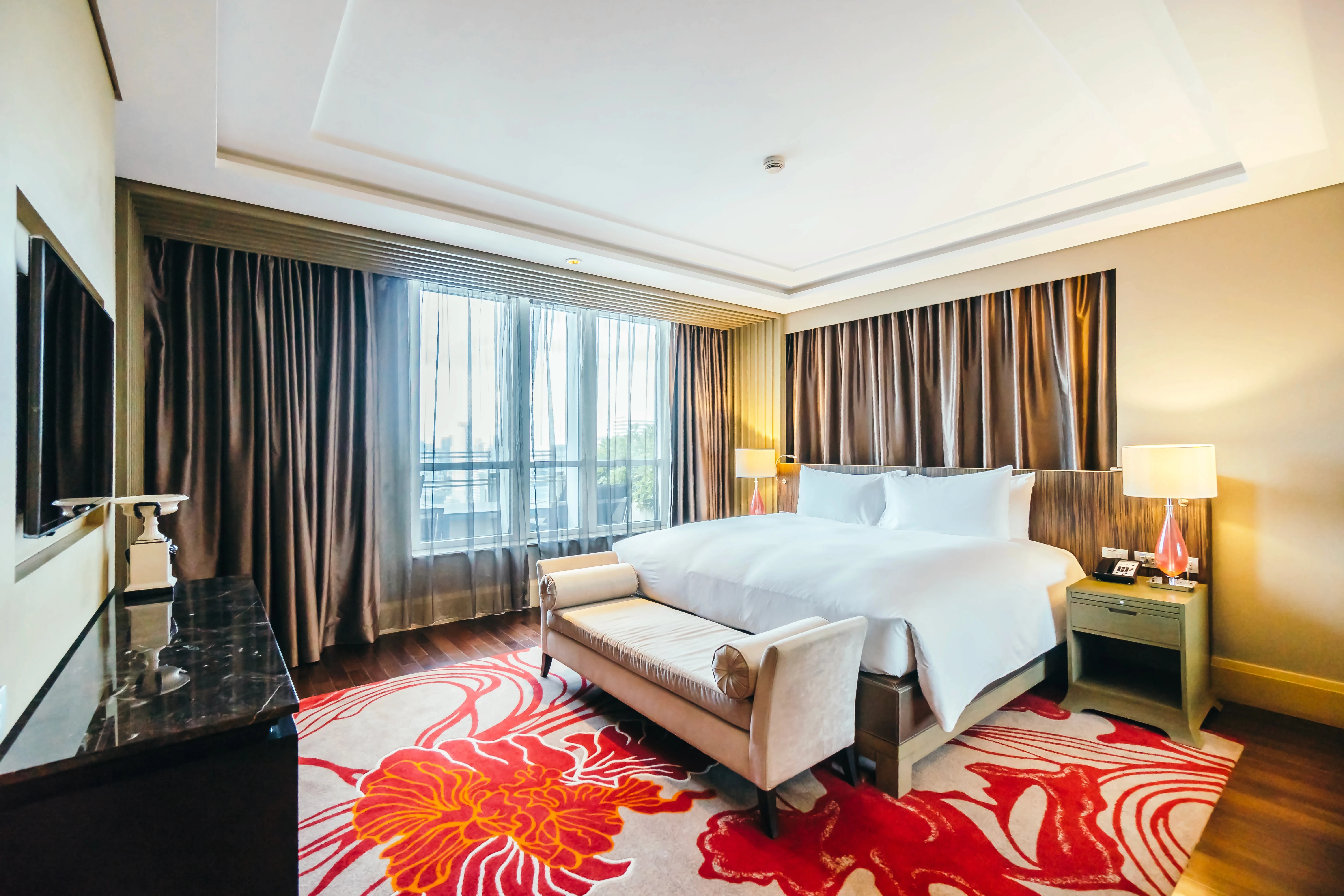 tidy-hotel-room-with-brown-curtains