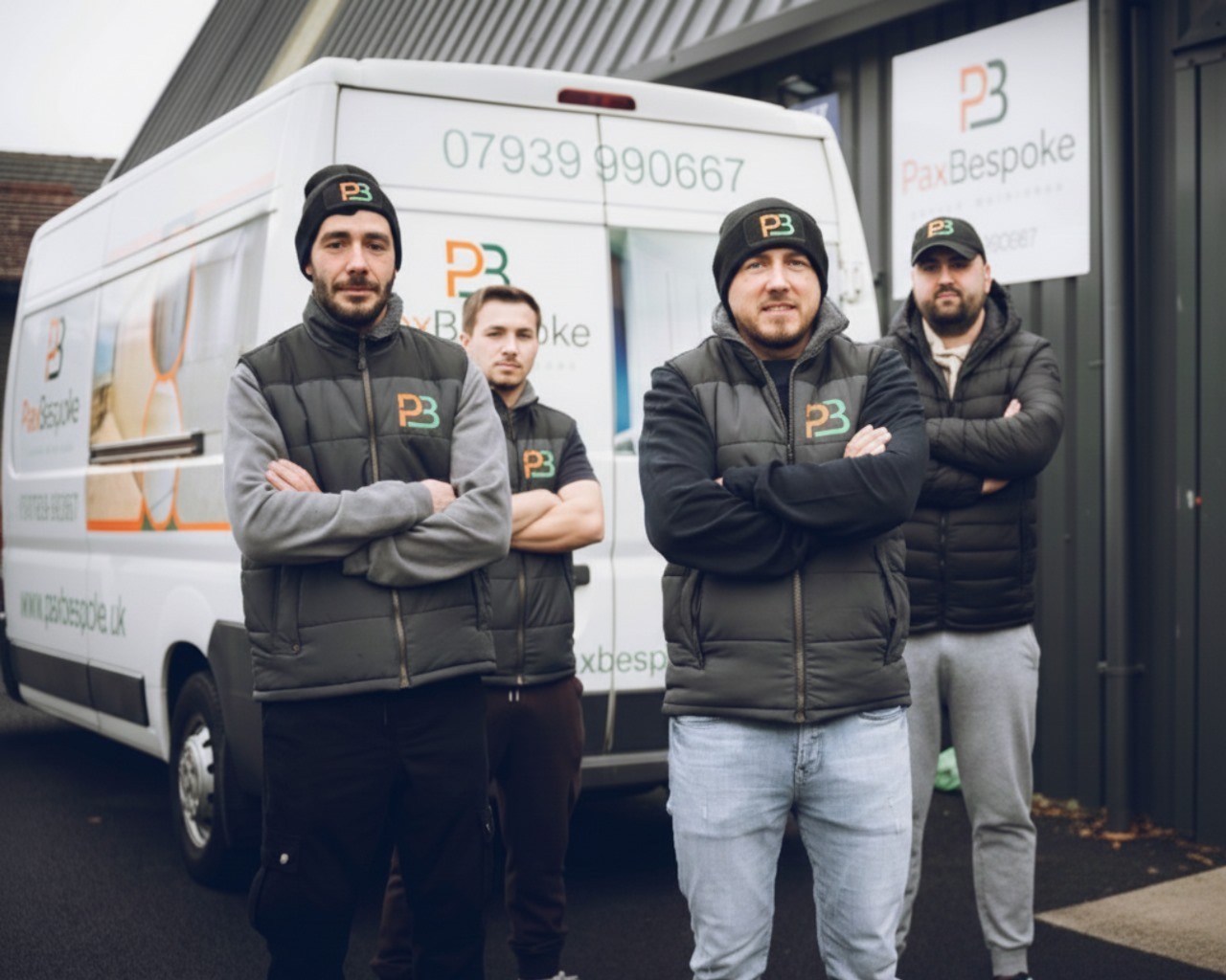 the PaxBespoke team and a work van
