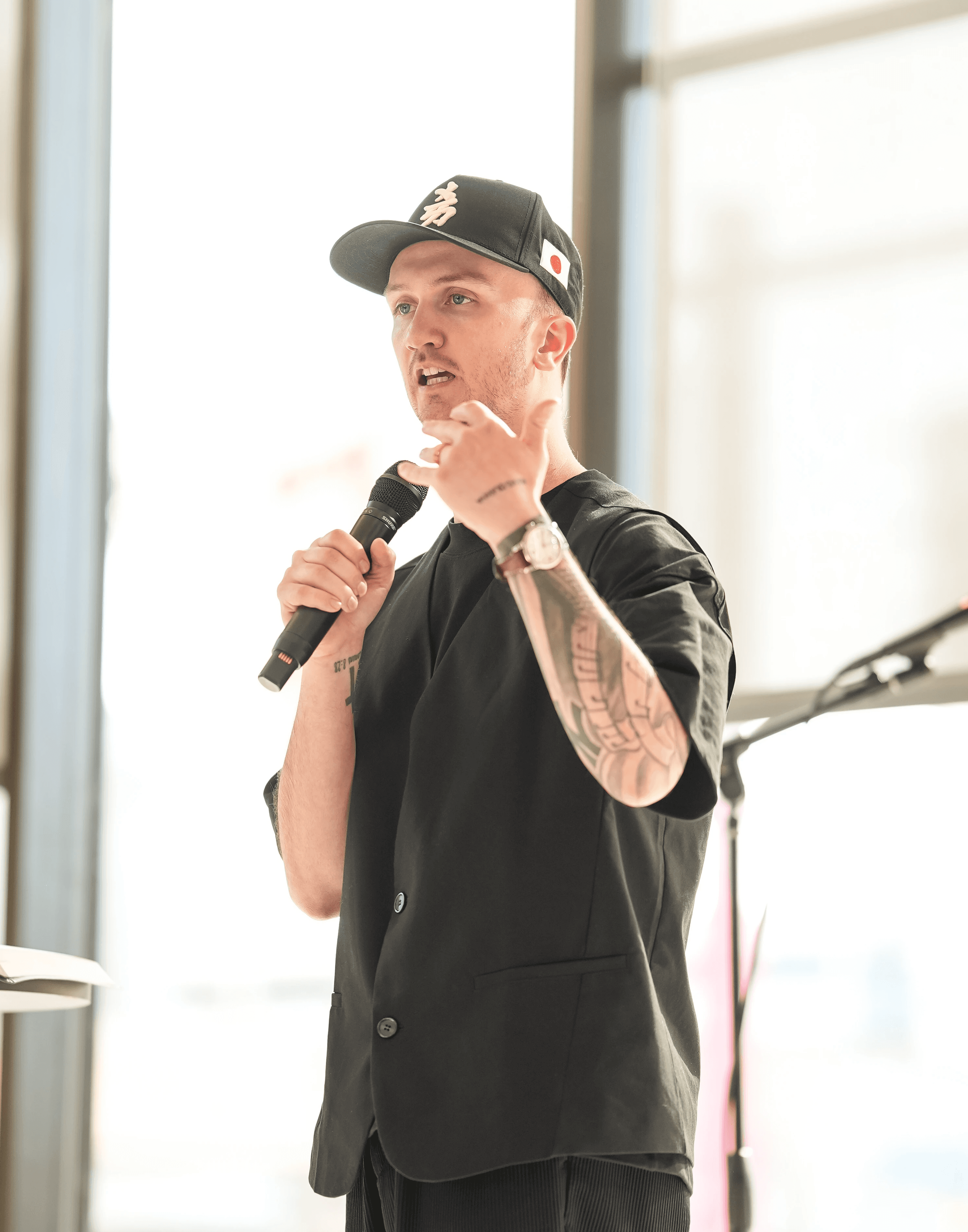 Josh Andrew preaching on stage about church leadership, culture, and discipleship