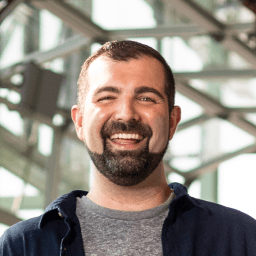 Possible member smiling and looking at the camera.