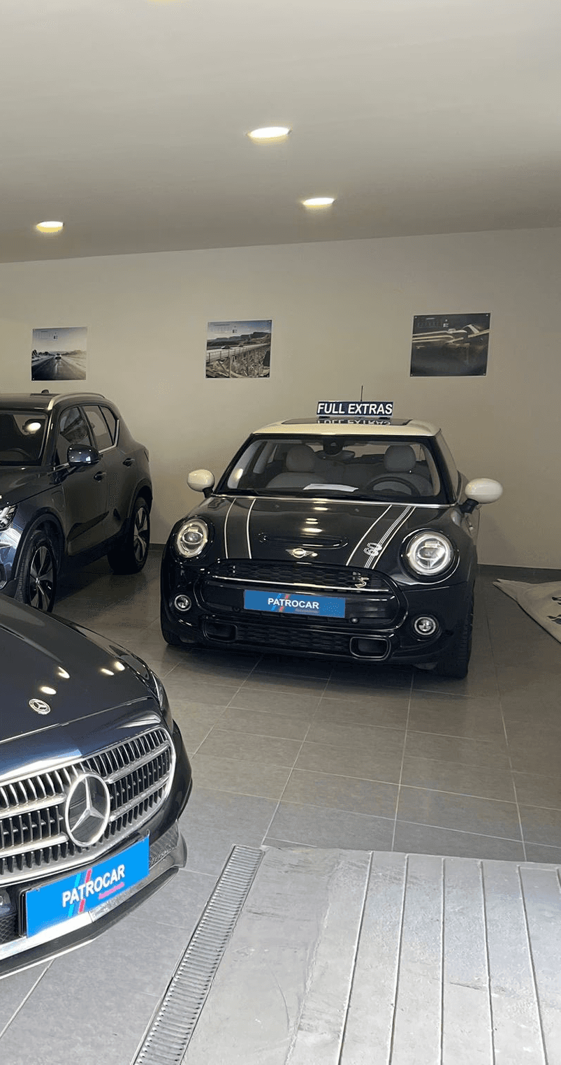 Collection of luxury sports cars displayed in modern rental showroom