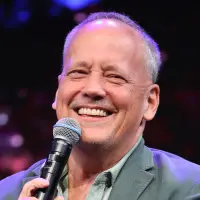 Dee Bradley Baker laughing with a microphone