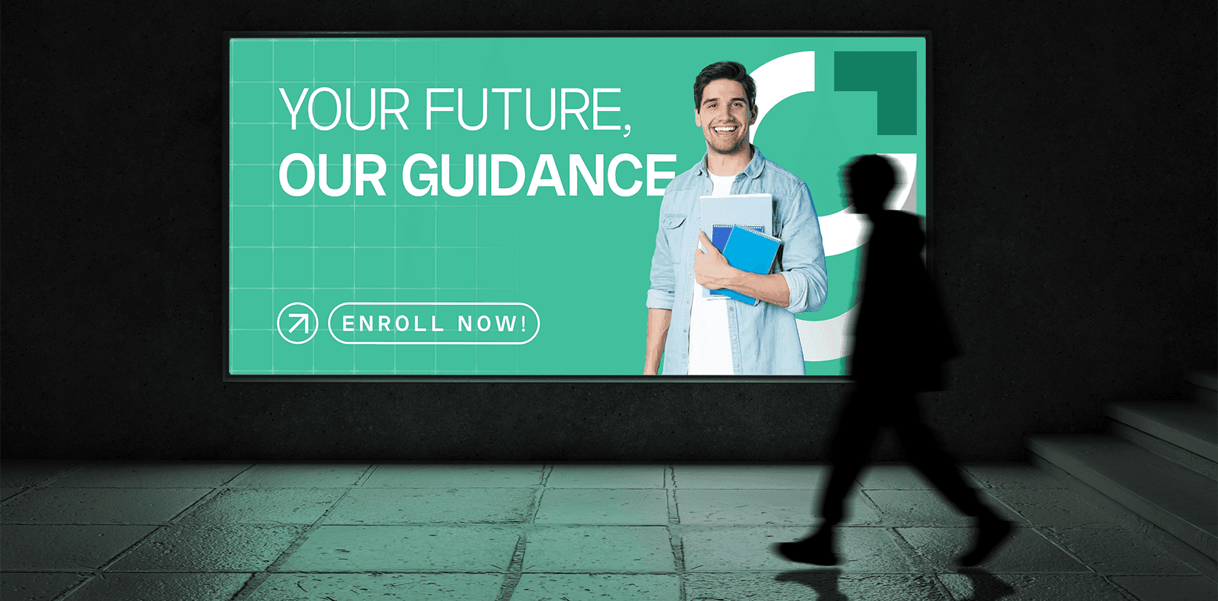 Gradure Admission billboard with the message ‘Your Future, Our Guidance,’ featuring a smiling student holding books and an ‘Enroll Now’ call-to-action in an underground walkway