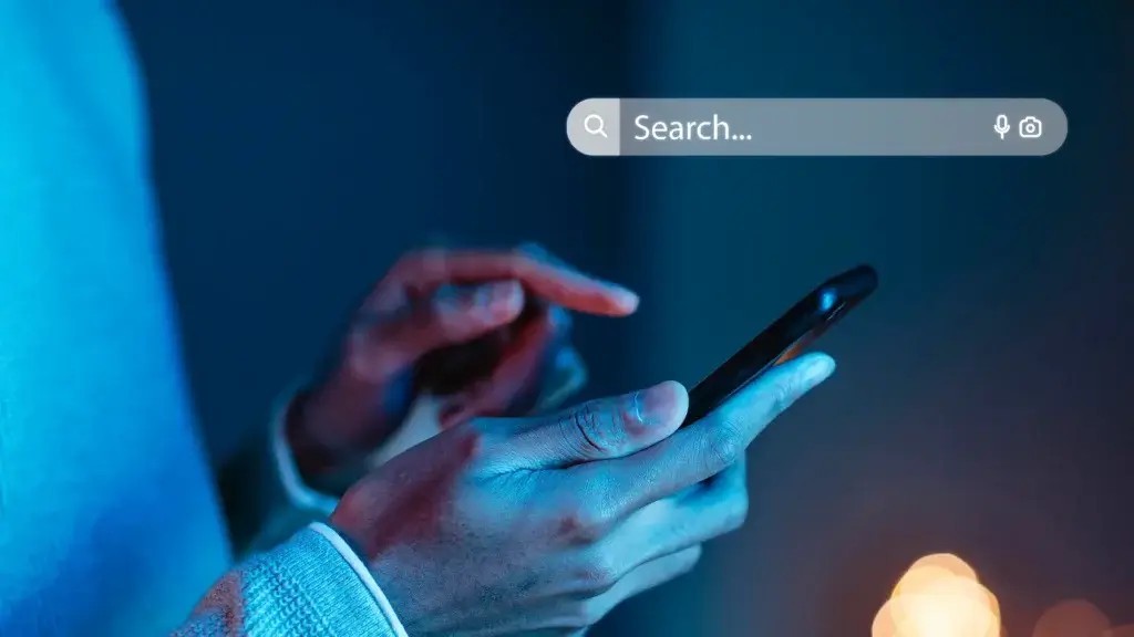 woman using smartphone to searching on Google photography blue