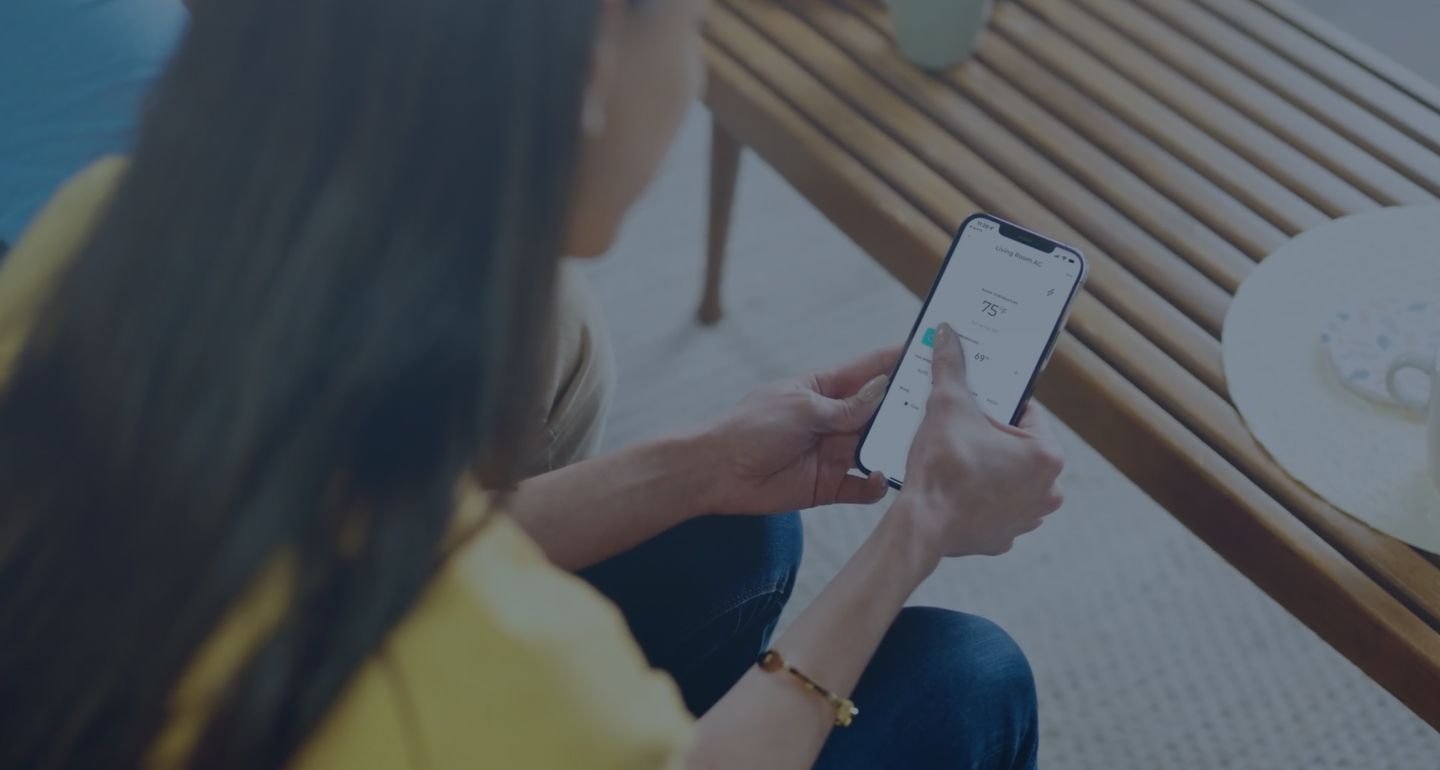 A woman uses the Windmill mobile app