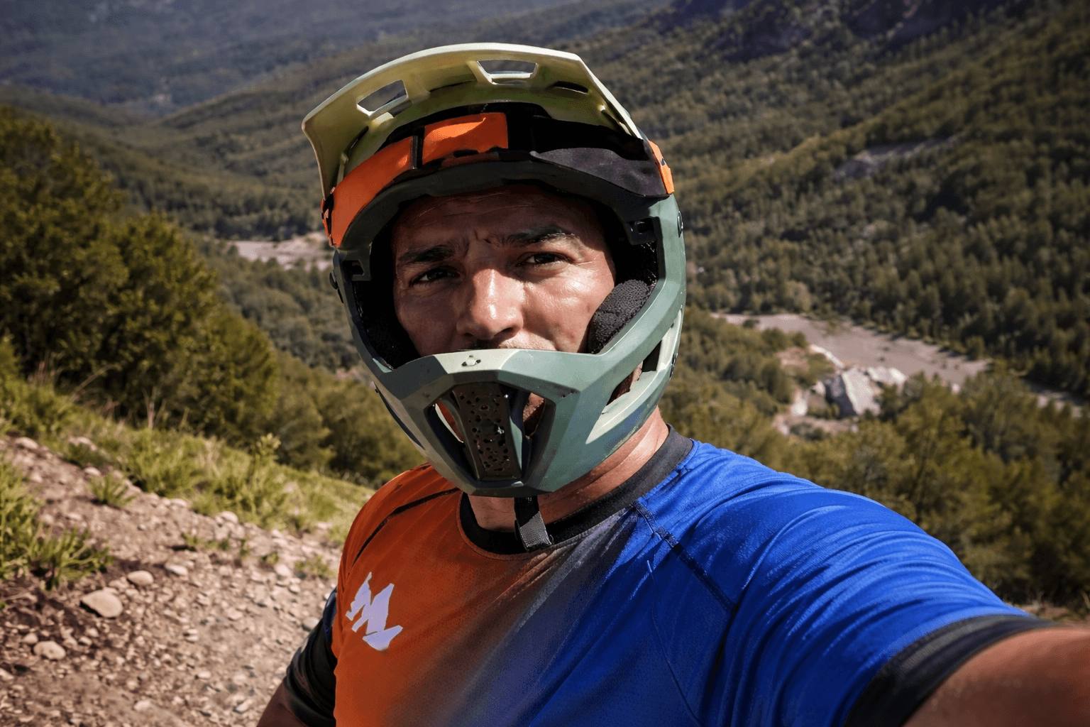man in black suit jacket holding white ceramic mug
