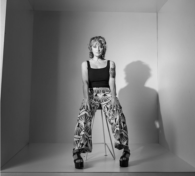 Rooftops of a coastal town with the sea in background