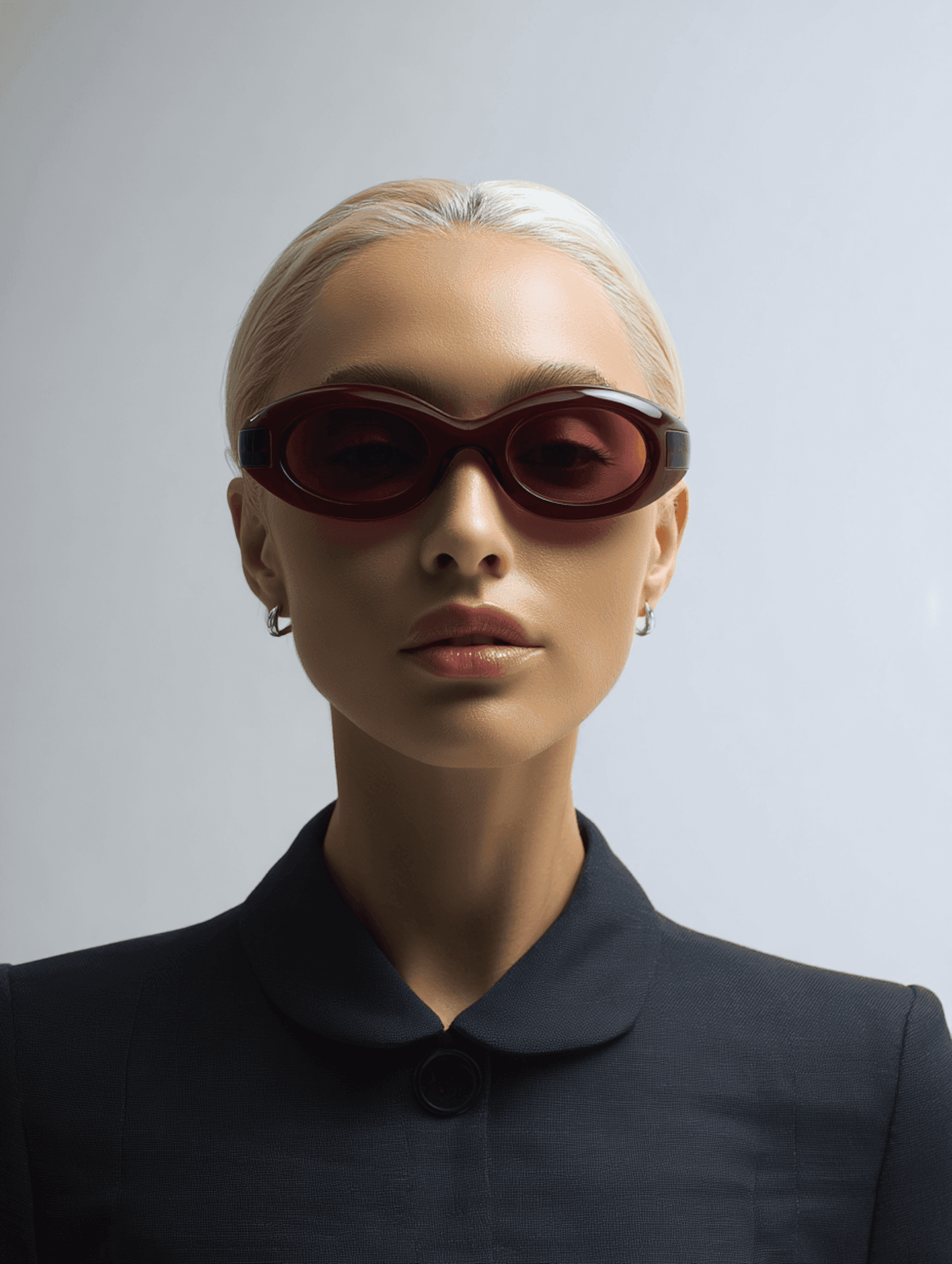 Woman wearing red oval sunglasses