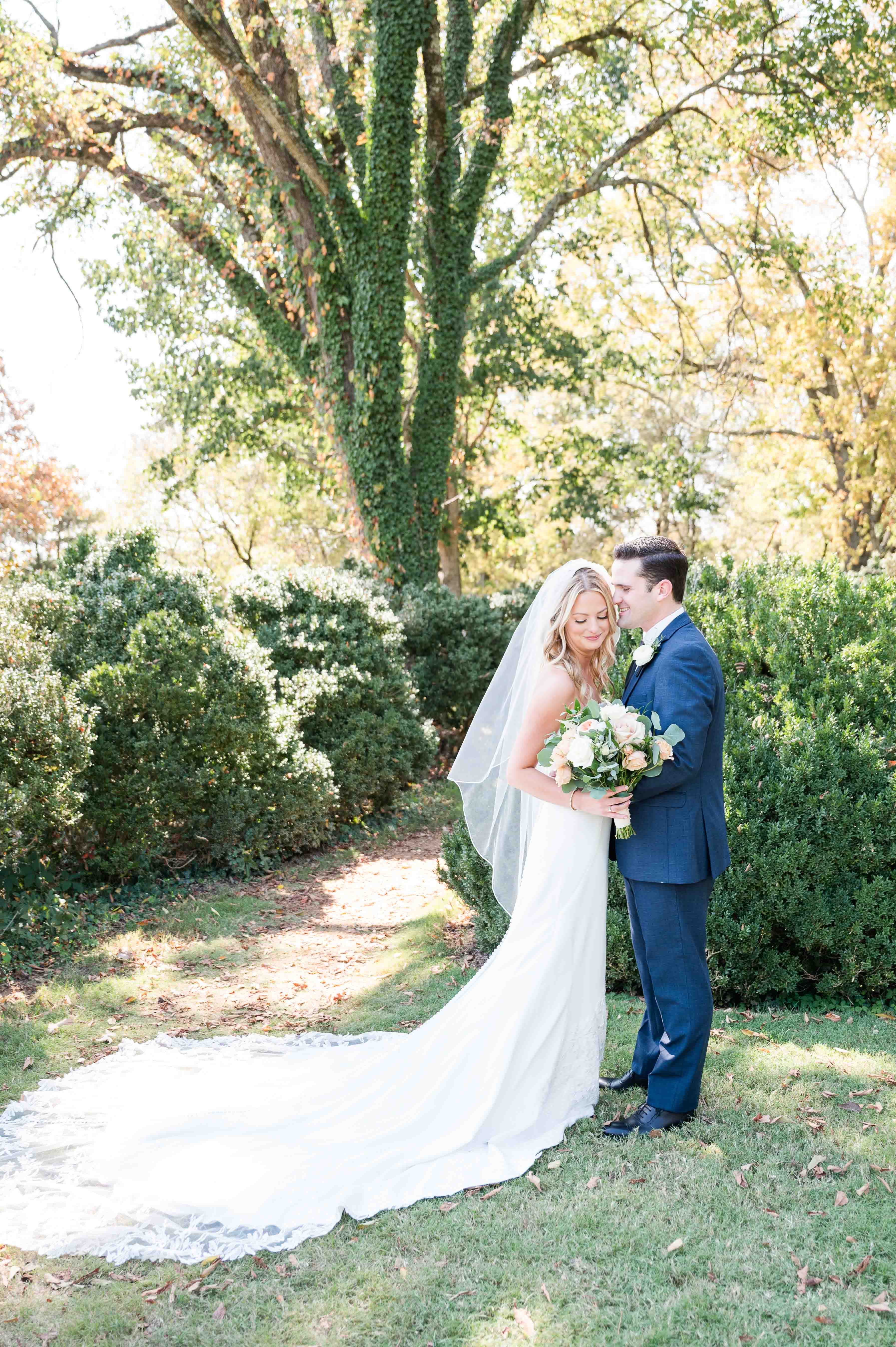 Bride and groom portrait at Cheekwood Gardens and Estate with gorgeous sunlight behind them.