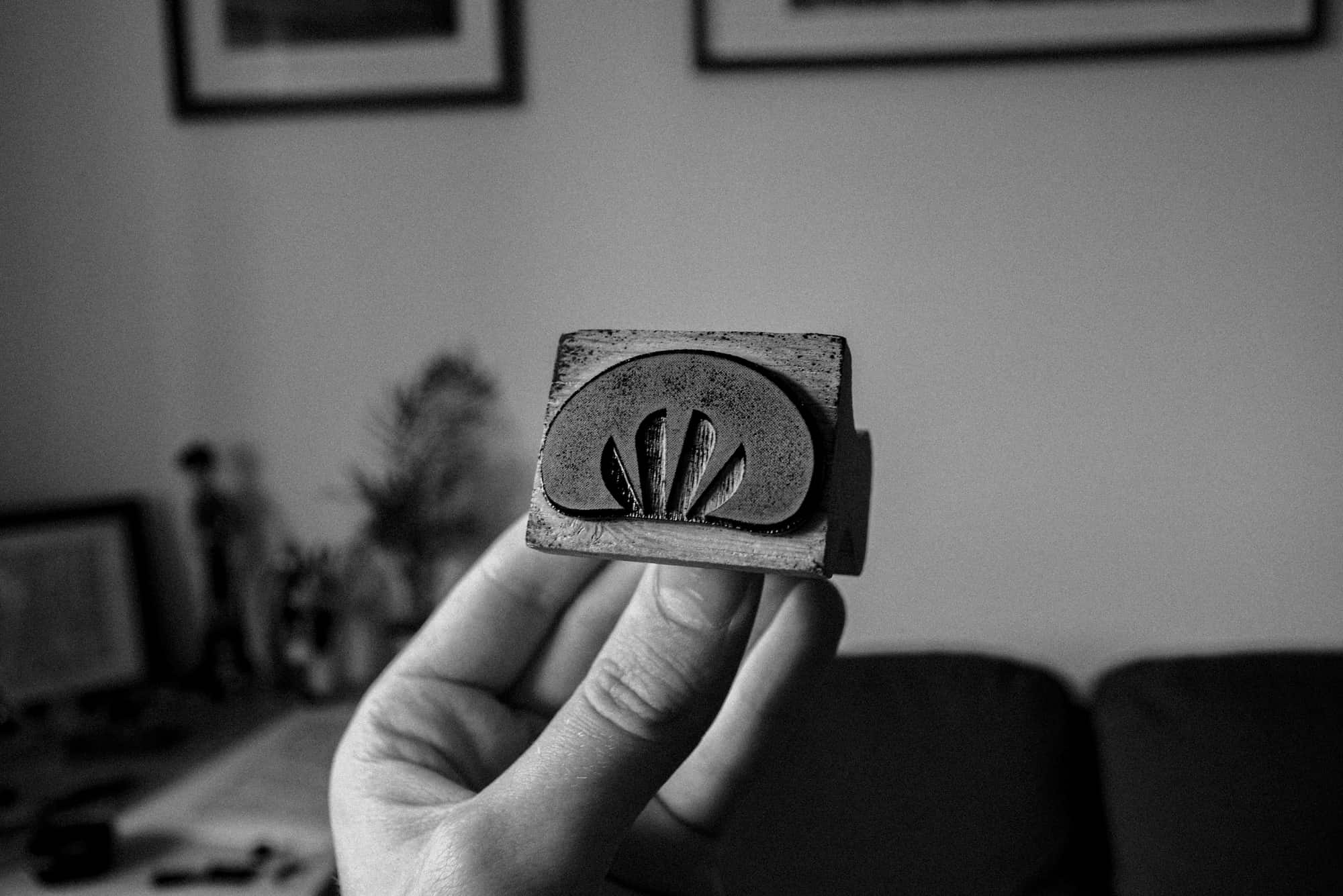 creep brand mark on stamp, photo in black & white filter.