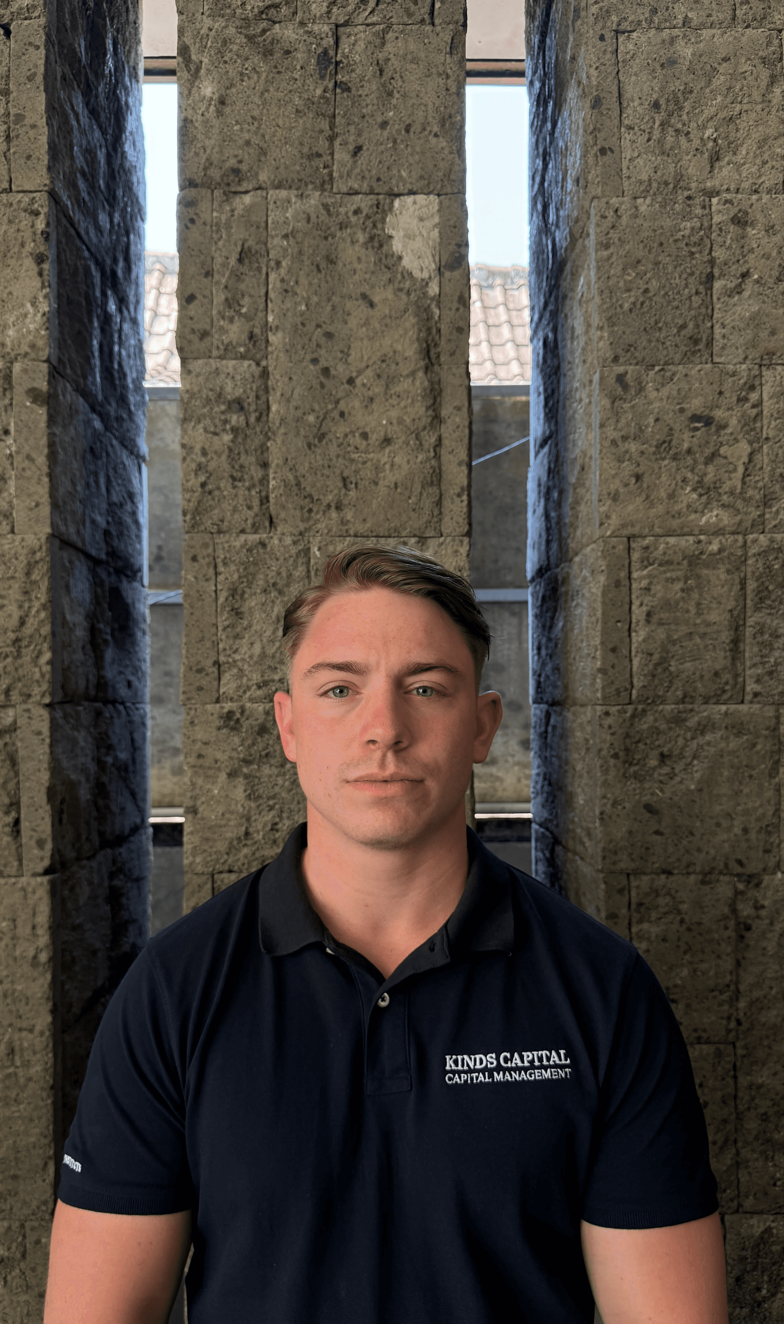 a gazebo sitting on top of a lush green hillside next to a lake