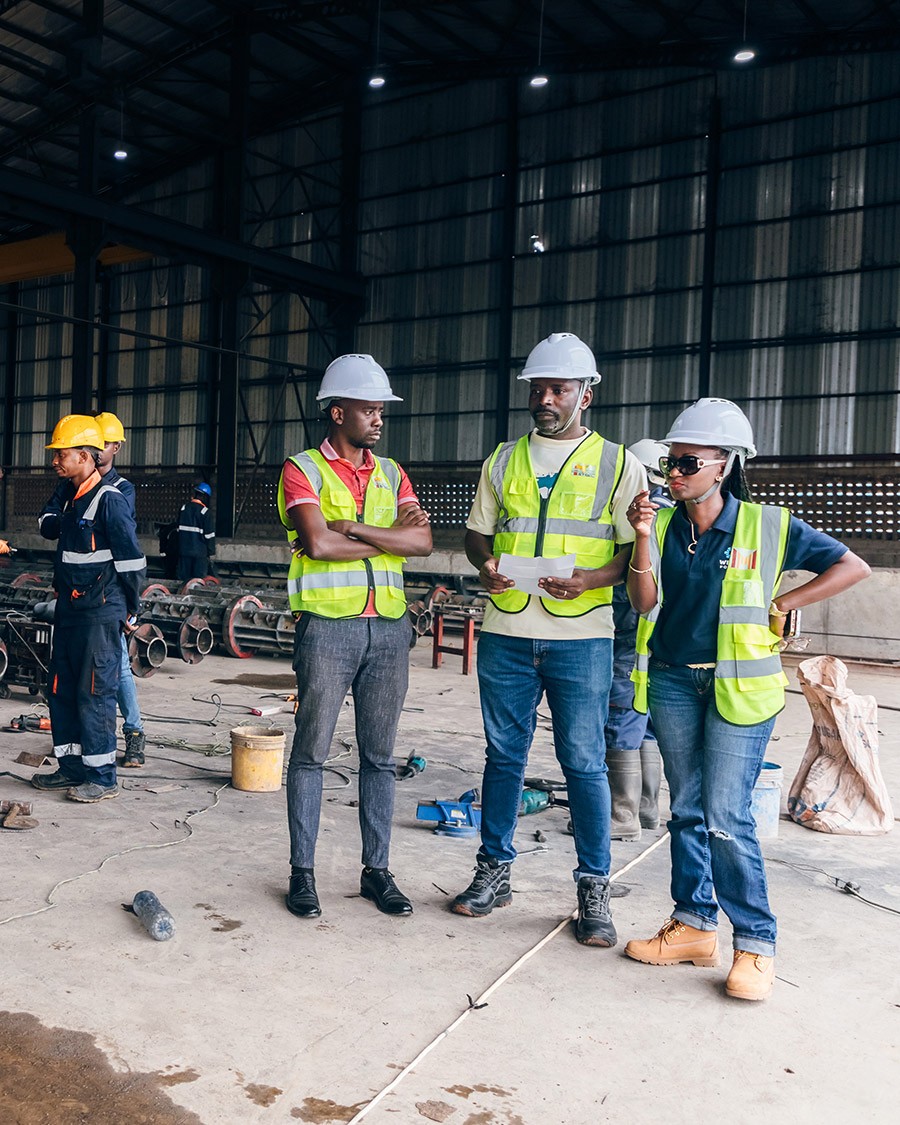 two men fix the solar panel