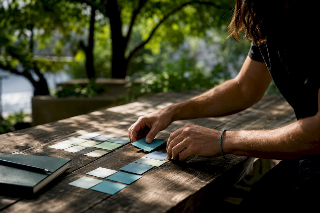 Hands sorting recruitment index cards manually