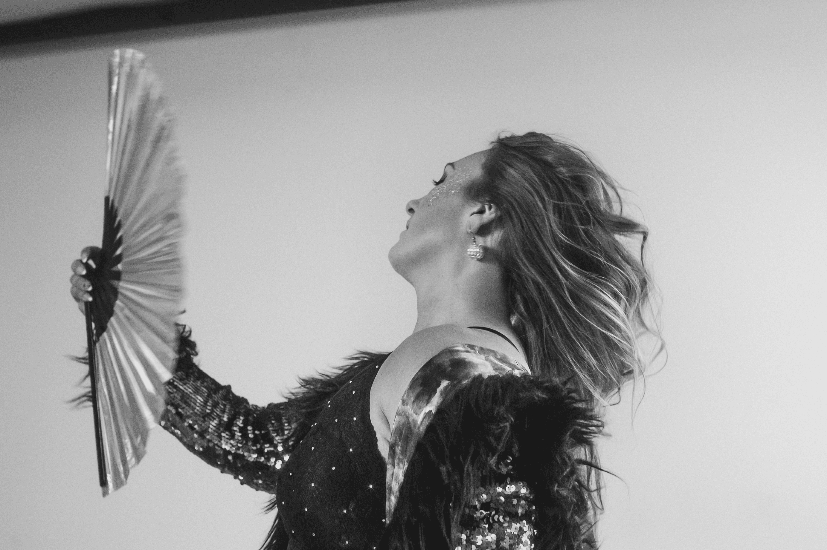  white (bottom centre right)Black and white photo of a woman dancing expressively in a flowing black outfit