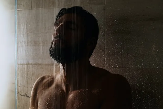 Man under cold shower 